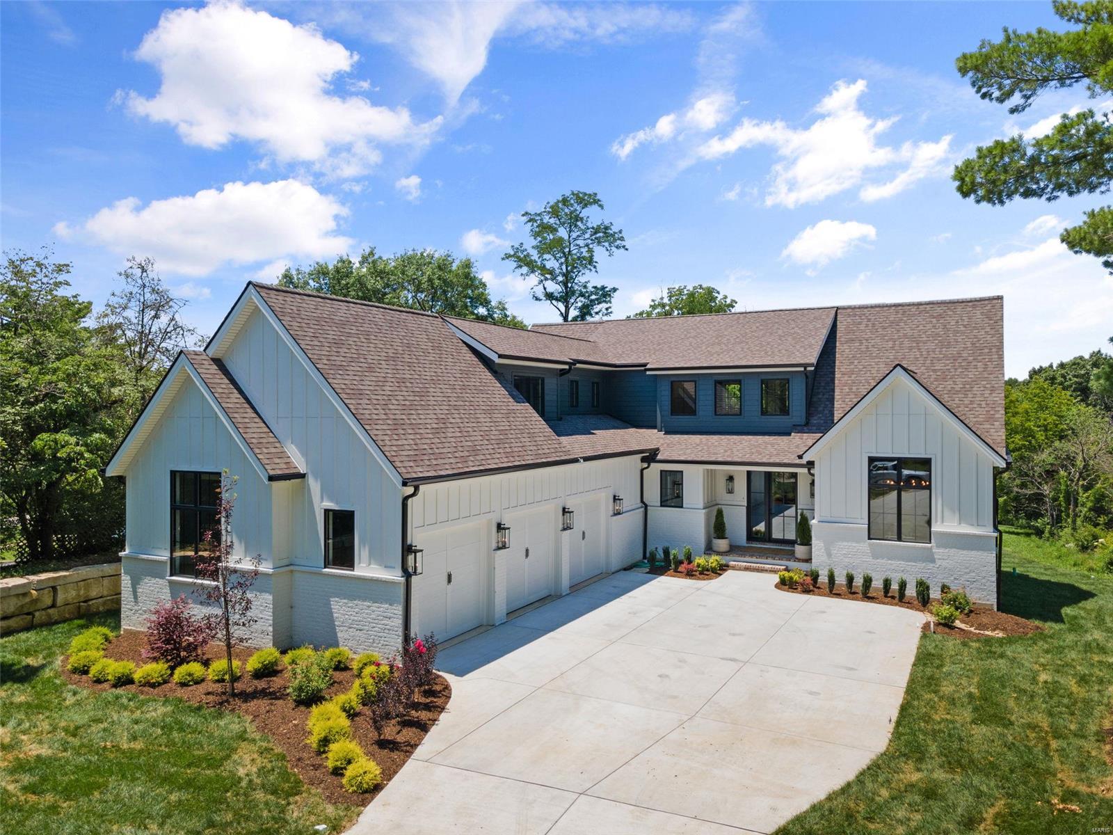 Rare opportunity to purchase a newly built home in Old Town & Country. Topping Road has a fabulous private "woodsy" feel surrounded by nature, and tons of open ground.  The natural habitat supports numerous wildlife while in the heart of St Louis County! The property incorporates over 5800 sq.ft of living space behind a subtle but stately facade including a fabulous main floor master suite and a gorgeous kitchen. There are 3 additional bedrooms upstairs with two lofts as well as a finished walk-out lower level. But the main level is the star of the show with a stunning kitchen and a rear screened porch where you can take in fabulous "sunset" views as you look out over a very private, gently sloping natural back yard. The lot has plenty of room for a pool, a pickle ball court a sport court and more.  Sidewalks have been approved for this side of Topping road and will be installed by T&C in the future. This home is truly stunning!