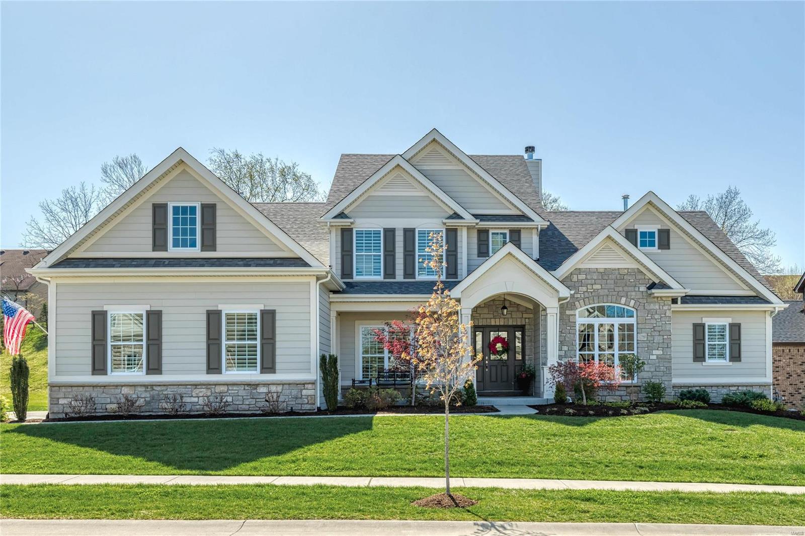 Beautifully designed 1.5 Sty from award-winning builder Prestige Custom Homes. Impressive entry foyer features wide plank hardwood flooring that extends into private study with French doors & built-in bookcase, elegant dining room with sculpted ceiling & stunning great room with wet bar, slate fireplace flanked by bookcases & 2-sty wall of windows. The main living area unfolds into the designer kitchen with white Shaker cabinetry, quartz countertops, KitchenAid appliances & 9’ center island. Light-filled breakfast room with beverage center & hearth room with floor-to-ceiling stone fireplace & atrium door to screened porch provide a welcoming gathering place.  Coffered master bedroom suite offers an appealing retreat with His & Hers walk-in closets & luxury bath with freestanding tub. Flared oak staircase accesses 3 additional bedrooms, 1 with ensuite bath & 2 with Jack n’ Jill bath, plus vaulted bonus room. Situated on a premium cul-de-sac lot with waterfall, patio & 3-car garage.