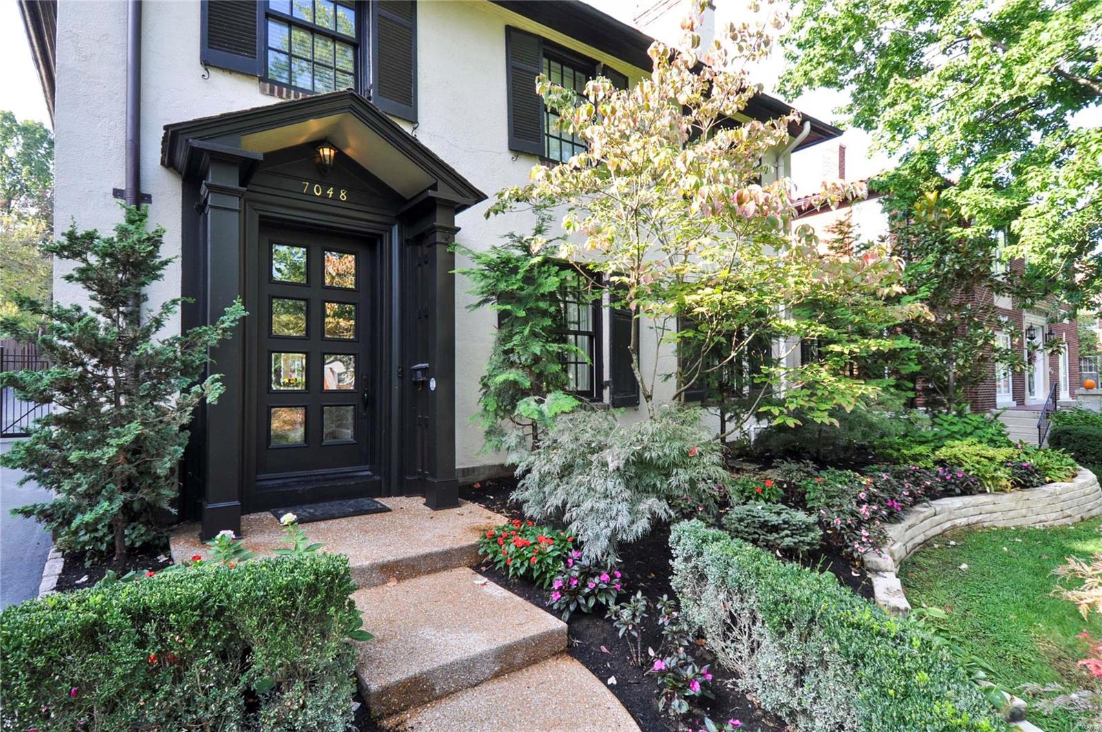 Est. 1922, this traditional Maritz & Young home has been redefined and improved upon to bring it up to the modern-day lifestyle. It lives large while still maintaining a warm, cozy vibe. From the foyer to the heath room, light pours in from the multitude of large windows and highlights the gorgeous hardwood floors and soaring ceilings. The generous living spaces are accentuated with beautiful ceiling millwork, deep crown moldings, built-in shelves and gas fireplaces. Every room has its own personality while also providing wonderful flow throughout. In 2006, an addition allowed for a spacious kitchen/hearth room that includes custom cabinetry, granite counters, stainless steel appliances, walk-in pantry, wet-bar area and mudroom. Just above is the master suite with walk-in closet and private bath with double vanities, separate tub and shower and heated floors. The patio, outdoor kitchen and pool area are everyone's favorite place to gather and enjoy good food and even better company. Additional Rooms: Mud Room