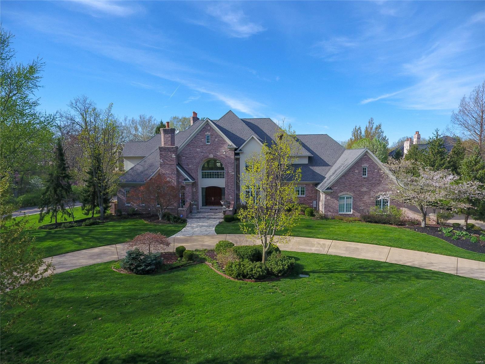 Magnificent Luxury home on Frontenac’s premiere Ballantrae Drive with nearly 9,400 square ft. of living space & designed for entertaining. This 5 BR/7 BA estate proudly showcases Mahogany doors, 2-sty cathedral foyer & a sweeping grand staircase. A 2-sty great rm w/a wall of windows & French doors. Formal Den w/ built ins & leaded glass entry. Two 24’ X 36’ decks. Generous rm scale & size, countless elaborate arches & moldings, soaring ceilings, & Italian marble. Hearth rm with cathedral ceiling & built ins. New gourmet kitchen w/custom cabinetry, butlers pantry, huge quartz island, a walk-in pantry, & Wolf & Subzero appliances. Luxurious main floor master suite, 6 full-masonry fireplaces, a fully-equipped home theatre, billiards room, fitness center w/ Vita spa, massage rm, & 2 full bars. Covered patio, sparkling outdoor architectural salt water pool & lush gardens. a 4-car insulated garage w/abundant overhead storage w Tesla charging station. 4-Zoned HVAC systems. A true gem.