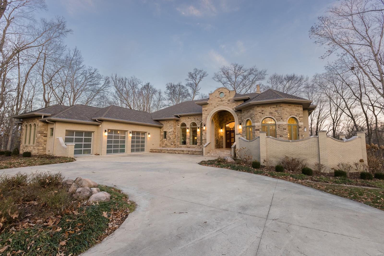 YOU WILL NOT FIND ANOTHER HOME IN O'FALLON LIKE THIS ONE! This custom one owner home sits at the back of a cul-de-sac on a private 3.7 acre lot! You will immediately notice the high-end finishes, upgrades & special details throughout, including the custom cherry wood dining room table that was made from trees cut down from the lot. The main level offers over 4,000 sq ft & is the perfect space for entertaining w/ the centrally located kitchen & accordion slider doors that open to 800 sq ft of covered lanai area. There is also an outdoor kitchen, a beautiful waterfall & a fenced in area perfect to add a pool. The master suite has double closets & a beautiful bathroom w/ spa tub, a walk-in tiled shower w/ double shower heads & its own private sun patio. The elevator in the home takes you to the finished walk-out basement. Basement features a large rec space, second family room, custom bar w/ wine cellar & an exercise room. Home has Geo-thermal. Too much to mention, Call for feature sheet. Additional Rooms: Wine Cellar