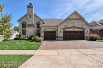 Fabulous free standing Luxury Villa! Largest plan available packed with upgraded features! Gorgeous hardwood floors,triple crown & fluted moldings,opulent dining room with large window & coffered ceiling.Two sty great room w/wall of windows, gas fireplace , built-in bookcases, 3 piece crown molding throughout. Fantastic kitchen complete w/ chocolate glaze cabinetry, huge island w/ 5 gas burner cooktop,built-in wine chiller, granite tops/backsplash & tray ceiling. Den w/ gas fireplace, upgraded mantle, stained crown molding & french doors. Master bedroom suite w/ bay window overlooks the golf course, 3 piece crown molding his & her walk-in closets. Elegant Master bath has marble vanity tops/flooring, furniture quality cabinets, Jetted tub, shower w/ body sprays. Two additional ensuite bedrooms w/ private baths. Lookout lower level has Family room, bar w/granite tops, stone fireplace 4th bed and bath. Private 3 seasons room overlooks the 5th green with nice size deck. Heated 3 car garage Location: Ground Level