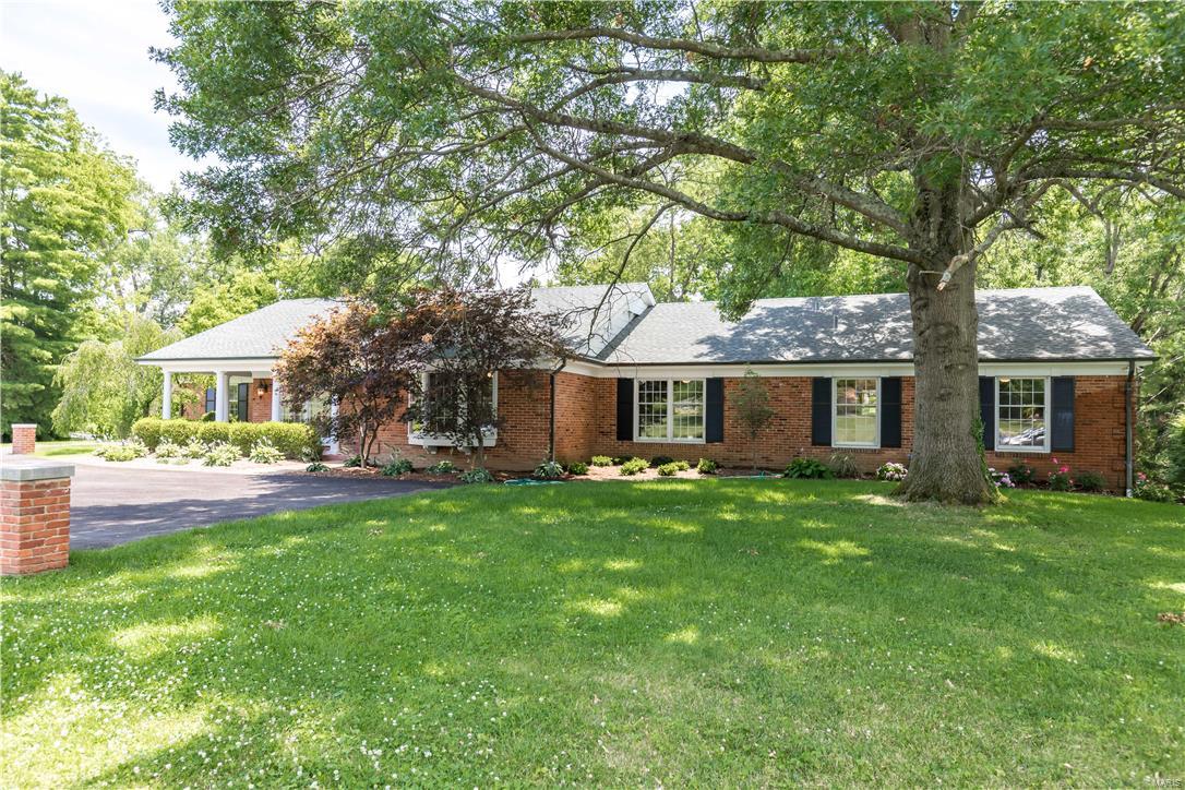 Wonderful ranch renovation in Frontenac. 5 Beds, 4.5 Baths, approx. 5,642 sq./ft. (3,216 ground floor+418 four seasons room+approximately 2,008 in the lower level). Open floor plan. Kitchen features custom cabinetry, double ovens, gas cook top & vented hood, microwave, beverage center, large pantry, and the huge island opens to hearth and family rooms, which in turn open to a large four-seasons room with a vaulted, wood beamed ceiling. 1st floor laundry with cabinets, sink and cubbies. Master suite with his and hers closets. Master bath features freestanding tub, double vanity with carrara marble, enclosed toilet area, linen closet, custom tile, and an over-sized shower with ceiling rain head, and wall-mounted hand-held shower head. Enormous finished lower level with bed, full bath, bar area, pre-wired for surround sound, and more. Much of the plumbing & electric have been replaced and/or updated, including a new 200 Amp panel & 100 Amp sub-panel. Aggregate patio overlooks the acre lot Additional Rooms: Mud Room, Sun Room
