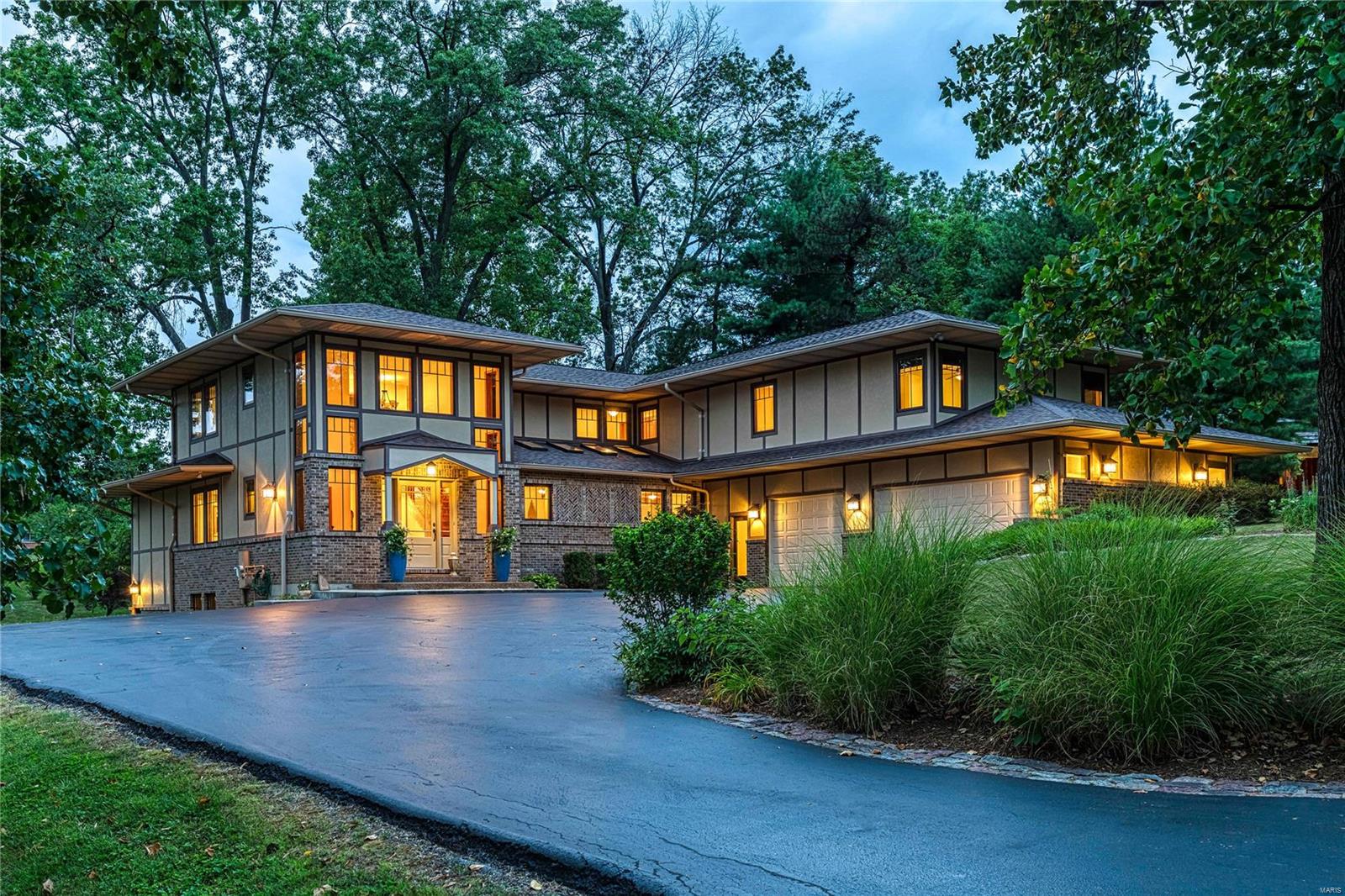 The Living is Easy in this welcoming, bright sanctuary of your dreams, where you can create lifelong memories! The Arts and Crafts accents and architectural design serve up a stunning blend of beautiful wood finishes, open spaces, soaring ceilings, natural light and outdoor access.
Elevate the everyday, whether utilizing one of three fireplaces, which add intimacy and ambiance inside and outside; -or enjoying a game of poker or pool, in the fabulous walk-out lower level. The primary suite delights as well, with vaulted ceilings, a beautiful spa bath, window views overlooking the lovely landscaped yard; and access to the deck.  The remaining four bedrooms and baths offer all of the classic essentials, with huge walk-in closets, and walls of windows: one bedroom takes you to the Serengeti, while another harkens back to sweet Shakespeare, with a Juliet Balcony above the great room and Chef's kitchen.  Cooking, lounging, or working from home are all made easy in this Sweet Spot! Enjoy!