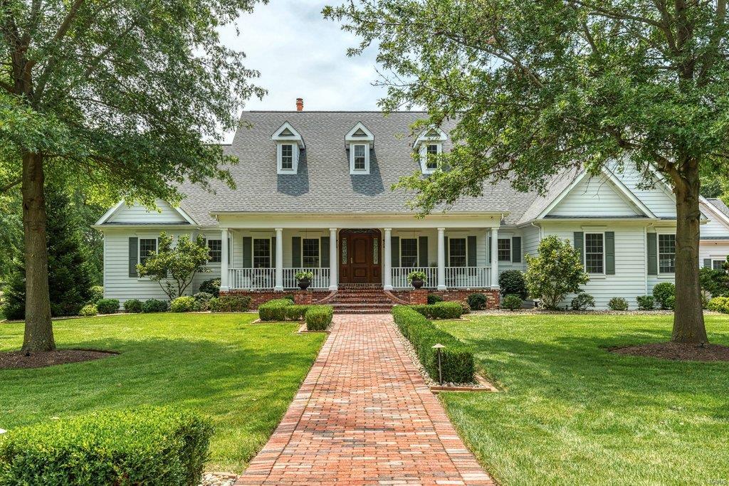 Picture perfect Cape Cod on parklike 5.4-acre grounds. This exceptional equestrian property features a fenced pasture & Morton 3-stall barn architecturally compatible with the home. Wide porch entrance with architectural columns leads to impressive oak foyer, private study with built-in bookcase, formal dining room framed by arched entryways & stunning great room with floor-to-ceiling stone fireplace, bookcase & dramatic wall of windows. Designer kitchen with bisque cabinetry, granite countertops & commercial grade appliances adjoins breakfast room with bay window & hearth room with brick fireplace & rear staircase that accesses bonus room. Spacious master bedroom suite with beautifully appointed bath plus a 2nd ensuite bedroom complete the main floor living quarters. Walk-out Lower Level includes recreation room with 3rd fireplace, game room, gathering bar & guest suite. Situated on a premium cul-de-sac lot with covered deck, patio, resort style pool, stone creek & 2 & 3-car garages.