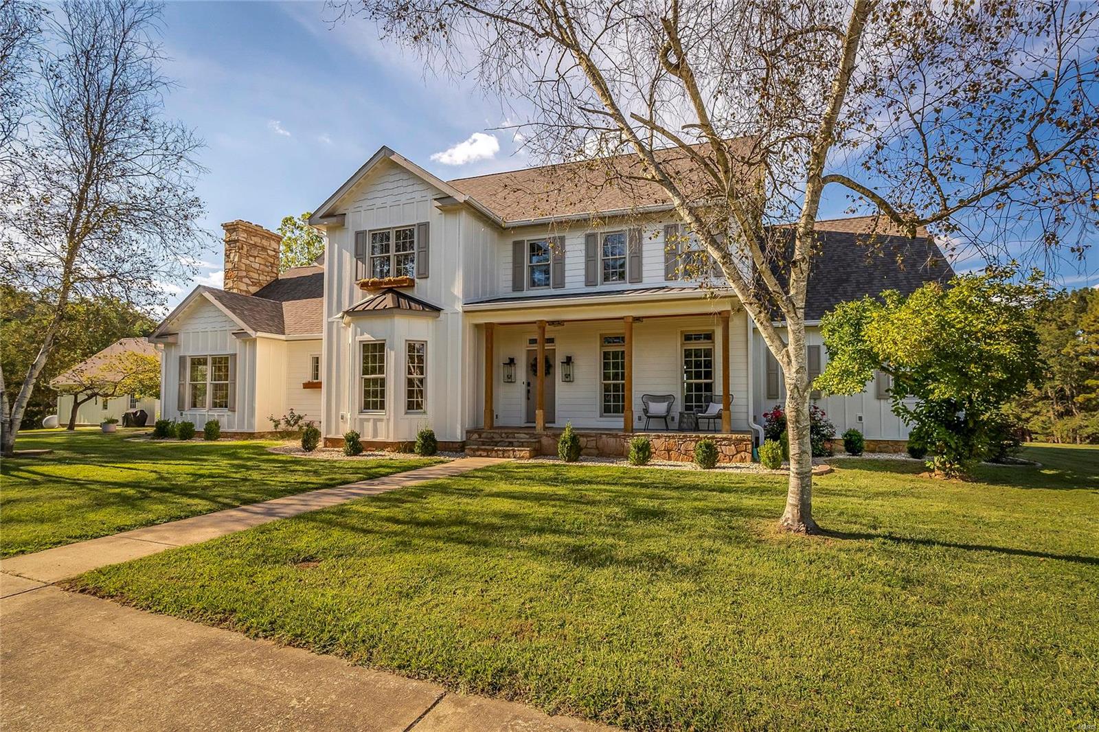 This stunning two-story home, currently operating as a luxury Airbnb, offers everything you need for family living or a profitable investment. The main floor features a welcoming hallway, office space, and expansive living and family rooms—ideal for hosting gatherings. The master suite offers a full bath, two walk-in closets, and serene privacy. Upstairs, you’ll find four spacious bedrooms (one can serve as a second master or guest suite) and two full baths. A finished basement has an extra bedroom, full bath, and bonus rooms for entertainment or storage. Relax on the open porch or covered wood deck while soaking in beautiful natural views. A  massive 40x80 metal barn with a concrete slab and electricity can be for equipment storage or animals. With two attached and two detached garages plus driveway parking, convenience is guaranteed. Whether you're looking for a forever home, vacation getaway, or income-generating Airbnb, this estate offers it all. Schedule your private tour today!