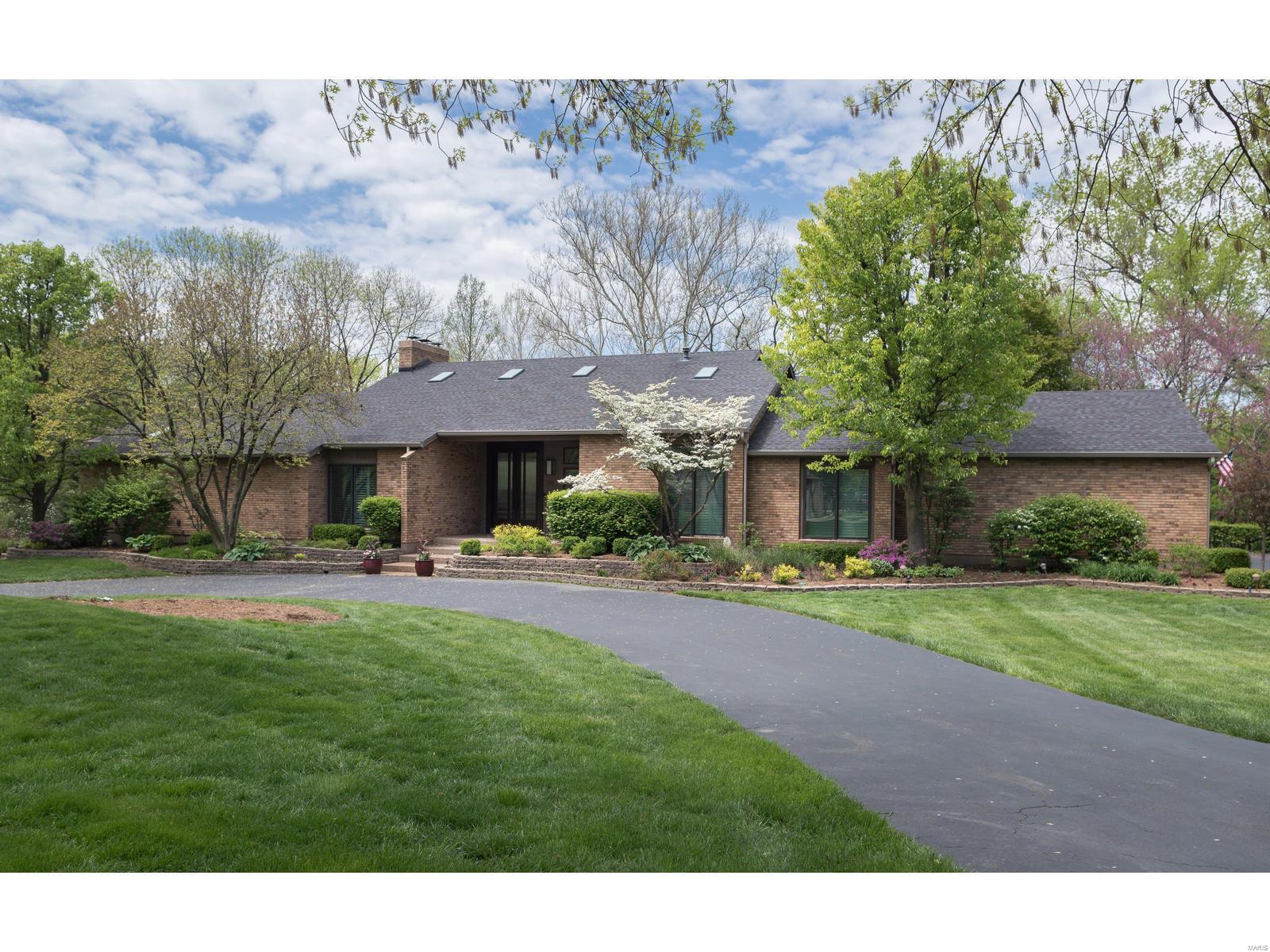 Stunning addition/renovation on 1.1 park like acres in the heart of Town & Country!  This is a WOW home...enter through mahogany glass doors and be in awe of the spacious open floor plan. This is what you've been waiting for! Gourmet chefs kitchen with custom bamboo cabinets, Wolf/Sub-Zero stainless appliances, granite counters & all open to new hearth room. Top of the line high end finishes throughout!Resort like views throughout the entire main floor looking out to your private backyard oasis with heated salt water pebble tec pool, huge grassy areas (plenty of room for tennis courts/sports court, kids &pets) & all backing to woods & trails. Gorgeous main floor master suite w/fireplace & walks out to the deck; luxury bath and his and her closets. 3 more bedrooms on the main level (one being used as an office).  Exquisite lower level is a dream space with HUGE rec spaces, full kitchen, gym, & walks out to the pool.  Perfect home for grand scale entertaining and everyday family living!