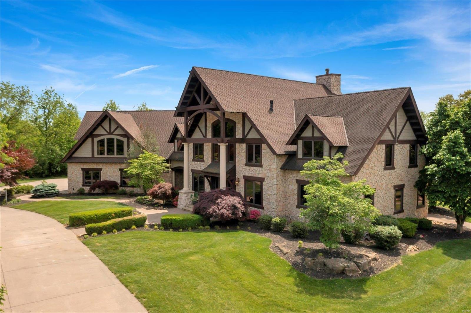 Welcome home to your luxury estate at 26374 Lake Richard Drive! This premium lakehouse includes a custom built craftsman main home, a guest house and a boat house. The main home has two master suites, a theatre room, upgraded chef's kitchen with Viking appliances and multiple fireplaces. The matching guest house sleeps 6 with a master bedroom and loft space. This cottage features a fireplace, Viking appliances and overlooks the 22 acre championship water skiing lake. There is a low-maintenance composite dock with three boat slips, a slide and a private beach. The three slip boat house opens directly to the water and includes a 500 gallon gas tank to keep your tank full all summer! Don't miss out on lake living, schedule your showing today!