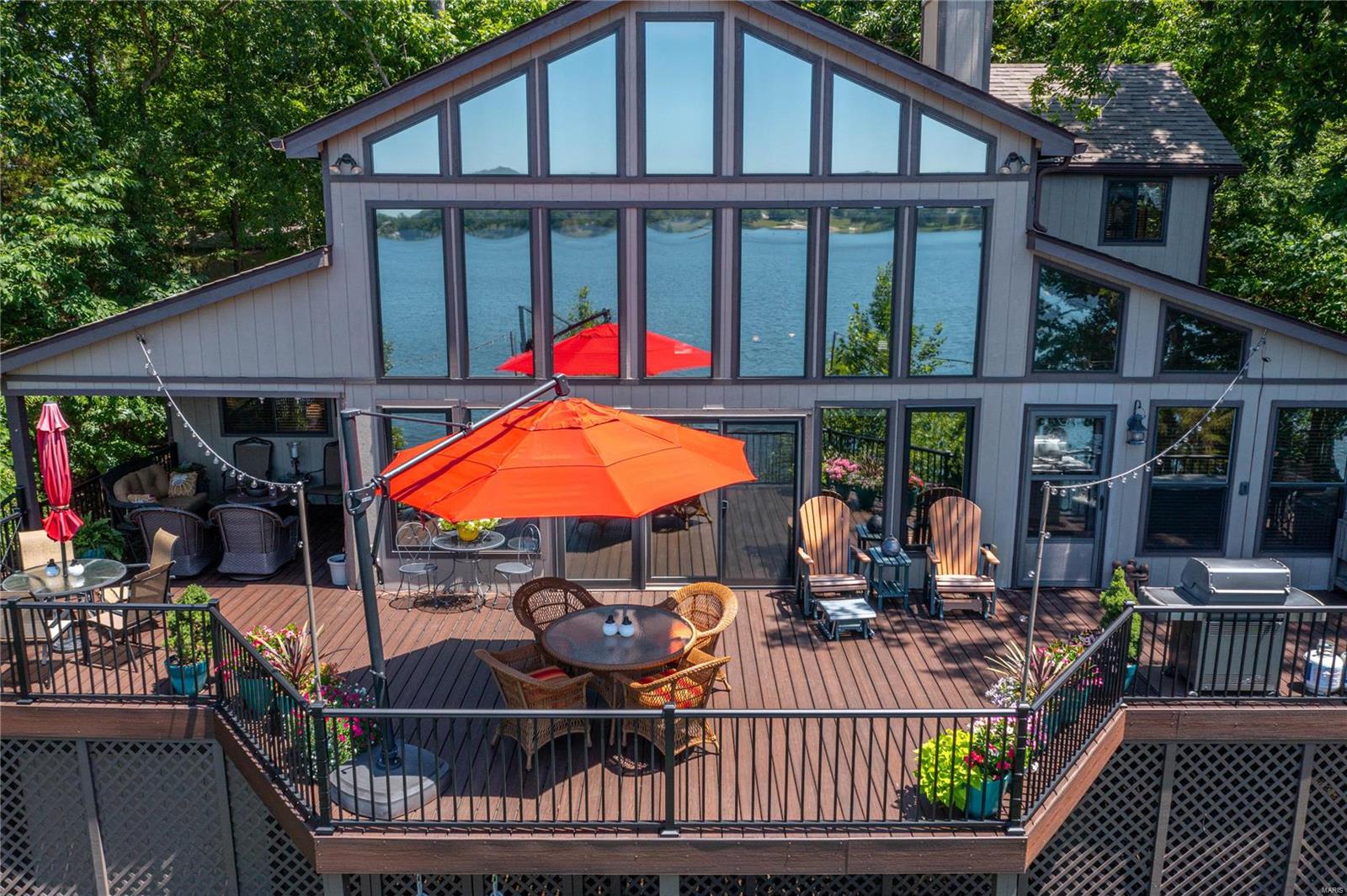 Innsbrook's FINEST chalet to hit the market, look no further than this luxury vacation home on LAKE ASPEN, one minute from the main gate and to ultimate relaxation. This is the vacation home for generations, where memories are created. Built for year-round living, this is one of the very best waterfront lots on Innsbrook's premier recreational fireworks lake. Just steps to the water's edge, enjoy million-dollar views & lakeside living like never before. This chalet with its lodge-like interior has everything you need and more, including zoned HVAC, 2700 sq feet of living space, large bedrooms, open living & dining rooms, master suite w/outdoor shower; hearth room w/2 sided fireplace & French doors for extra sleeping space. The new maintenance-free deck is partly covered and includes steps down to the beautifully landscaped yard with an inground sprinkler system. Golf cart and some furnishings included; other furniture, pontoon boat negotiable with offer.