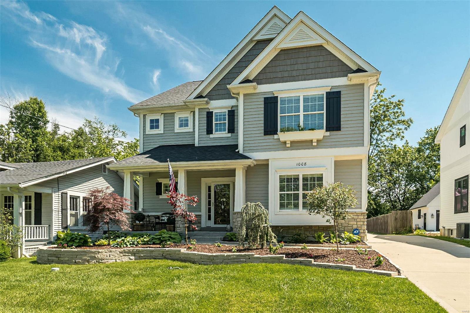 This sophisticated 2 Sty features over 4100 sf of living space enhanced by detailed trim work, custom built-ins, plantation shutters & oak hardwoods that extend throughout the main floor. Wide porch entrance highlighted by architectural pillars leads to impressive foyer, formal living room with French doors, light-filled dining room & stunning great room with wine bar & stacked stone fireplace flanked by built-in bookcases. Designer kitchen is a chef’s delight with white Shaker cabinetry, granite countertops, Pro Series appliances & 8’ center island. Spacious primary bedroom suite with tray ceiling, 2 walk-in closets & luxury bath offers an appealing retreat. 3 Additional bedrooms & hall full bath complete the 2nd floor living quarters. Lower Level entertainment space includes recreation room with wet bar plus 5th & 6th bedrooms & full bath. Walkable neighborhood located near shopping, restaurants & Larson Park with easy access to Hwy 270. North Glendale Elementary is just steps away. Additional Rooms: Mud Room
