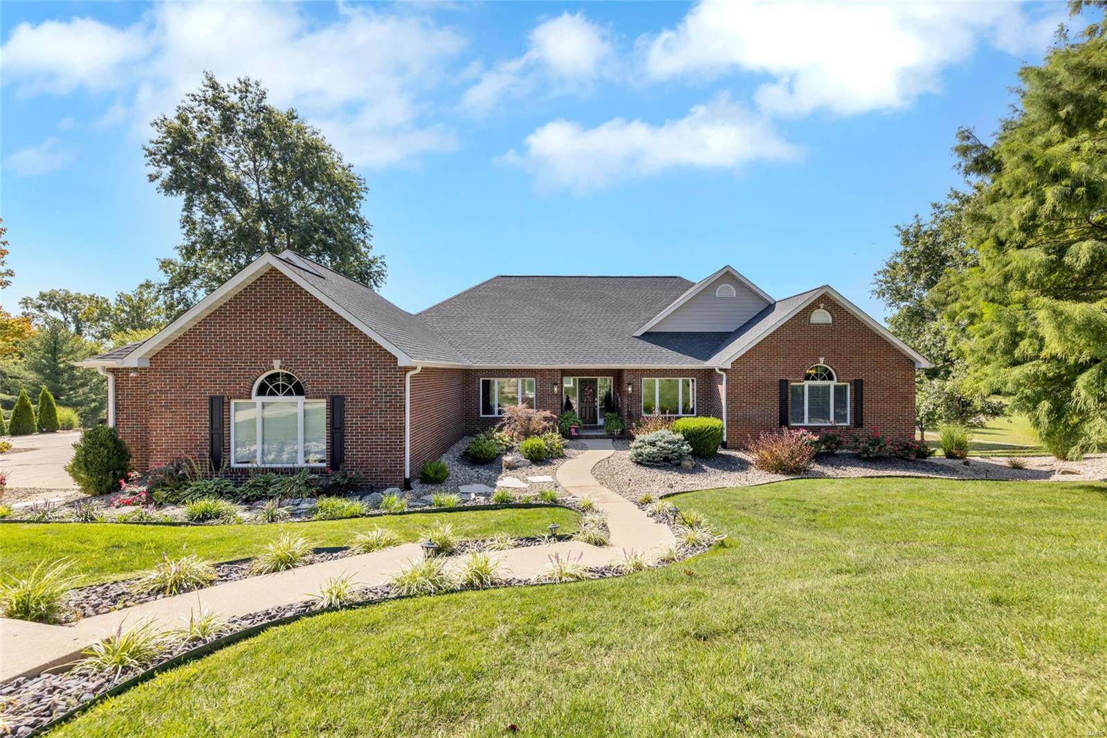 This truly exceptional home situated on a private lot with serene views exudes sophisticated elegance and comfort! Beautiful curb appeal w/lush landscaping invites you into the stunning foyer- appreciate the tall ceilings, new flooring, & custom built-ins-picture yourself HOME! The designer kitchen is the heart of the home w/massive center island, tile backsplash, and gorgeous wet bar w/ice machine & bev fridge-perfect for large gatherings.  The breathtaking primary suite boasts a fireplace, 12X14 walk-in closet w/island, & exquisite primary bath w/stunning tiled shower. All baths have been beautifully renovated w/ tiled showers & upgraded vanities. Downstairs is your place to entertain! The wet bar features granite counters, ice machine, fridge, & abundant storage. The WOW factor continues outside w/a heated salt-water pool w/ fountain, tanning ledge & barstools, multi-level deck, & tranquil view. Your dream home offers privacy, space & modern refinement at its best! Agent owned. Additional Rooms: Mud Room