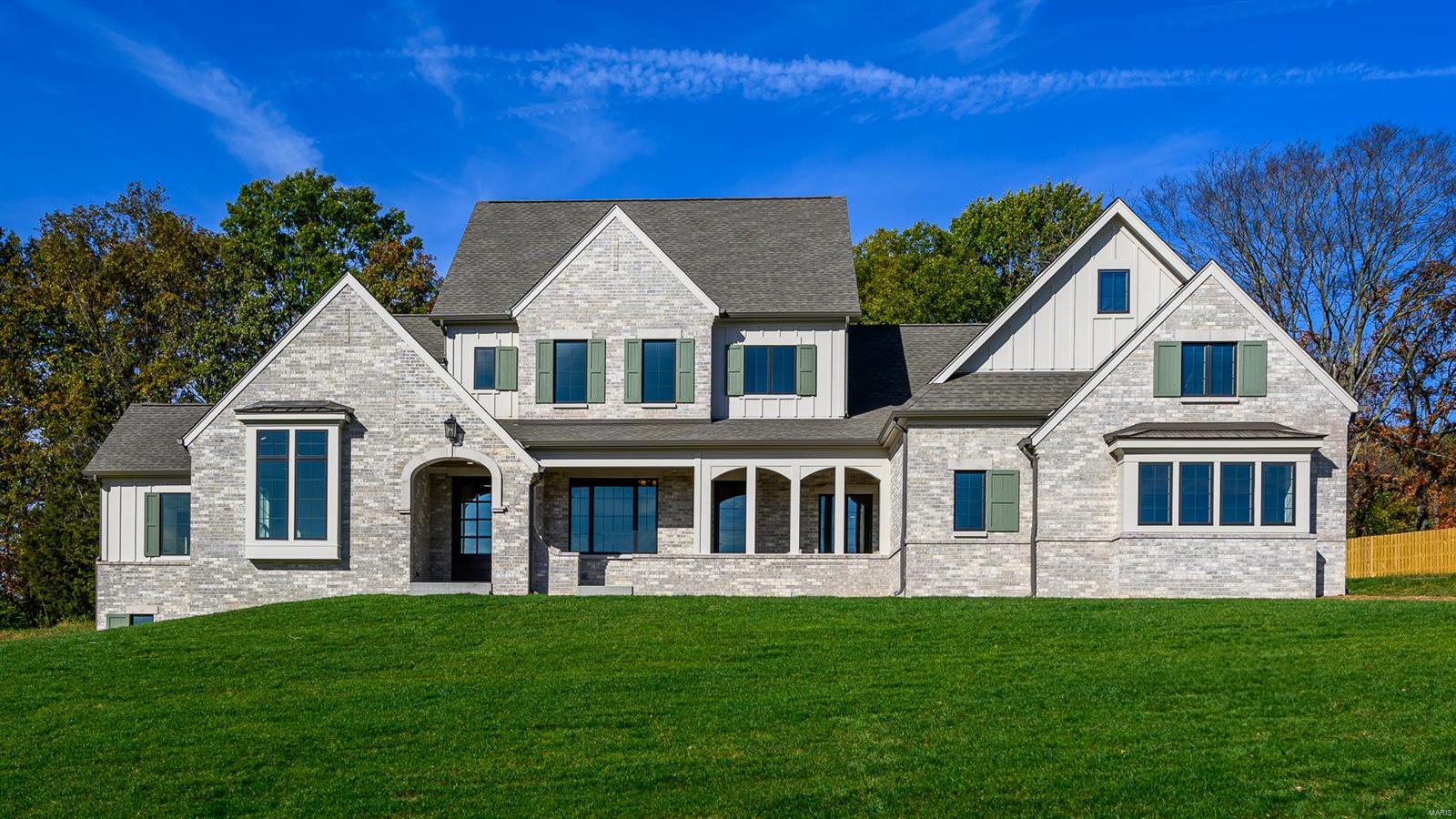 Welcome to your dream home!  This stunning 4 bedroom, 6 bathroom, 1.5 story with 4 car garage estate features exquisite craftmanship, panoramic views, and high-end finishes throughout.  This inventory home is one of 18 luxurious homes nestled on 26 acres.  Experience the best in luxury living, where elegance meets nature.  Stunning custom home with brick & cut stone front, set on a private 1.04 acre lot, in a gated community.  Features a concrete driveway & patio, screen covered front porch & architectural shingles.  First floor boasts 10' & 9' ceilings, while the primary suite offers coffered ceilings, his & hers walk in closets, & luxurious private bath.  Enjoy Bosch appliances, 42" wall cabinets with crown molding, quartz kitchen countertops, a walk in pantry, gas fireplace, 400 AMP electrical service, Pella windows & doors off the dining & breakfast room and a four car garage.  Schedule your private home tour today! Duplicate listing 24070196.