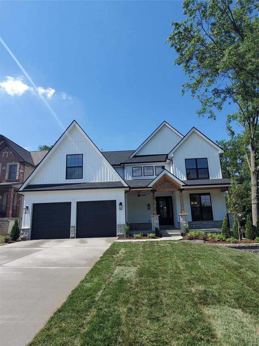 Beautiful Custom Home just completed in Ladue Schools built by MRM Manlin Development Group. This home has 5 Bedrooms and 4.5 Baths which includes a highly desired main floor master. Light filled open floor plan, hardwood flooring on main level and 2nd floor halls. Gourmet center isle kitchen, solid surface tops, breakfast area. Butler pantry with wine cooler. Large great room with direct vent fireplace, box beam ceiling. Master suite offers vaulted ceiling, private bath with freestanding tub and separate shower. Huge walk in closet with laundry area. Second floor has 3 additional bedrooms and a large bonus room. Laundry area on second floor. Lower Level has bedroom, full bath with tiled shower, large recreational area. Custom moldings add the extra touch to the craftsmanship of this home. Composite deck out the great room has wood burning fireplace complete with stone surround. Exquisite backyard, shows off this oversized lot. Close to walking trails, schools and quick highway access.