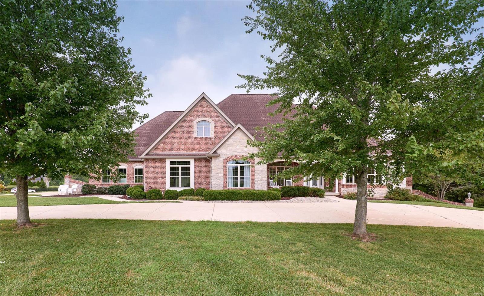 EXQUSITE Custom Ranch on 3.17 acres. 4 car oversized garage. This home is special from the moment you walk in. The marble flooring, soaring ceilings and views out the windows are show stoppers!  There are 3 bedrooms 2 full & 2- 1/2 baths on the main level. The 4th bedroom , family room, bonus room, dry serving bar and & full bath are on the walk out Lower Level. Chief's appointed kitchen, w/oversized butterfly island, granite counters under counter beverage refrigerator and bar sink.  Oversized walk-in pantry, main level laundry & separate mud room with double closet. Custom formed Gunite Salt water pool with waterfall and fire pots. Pool also has has a heater.  There is a pool changing room/ 1/2 bathroom right off of the covered patio. There is a sprinkler system, zoned Heating & Cooling.  Large storage with built-in shelving and work bench area in the unfinished Lower level.  Make your appointment today.