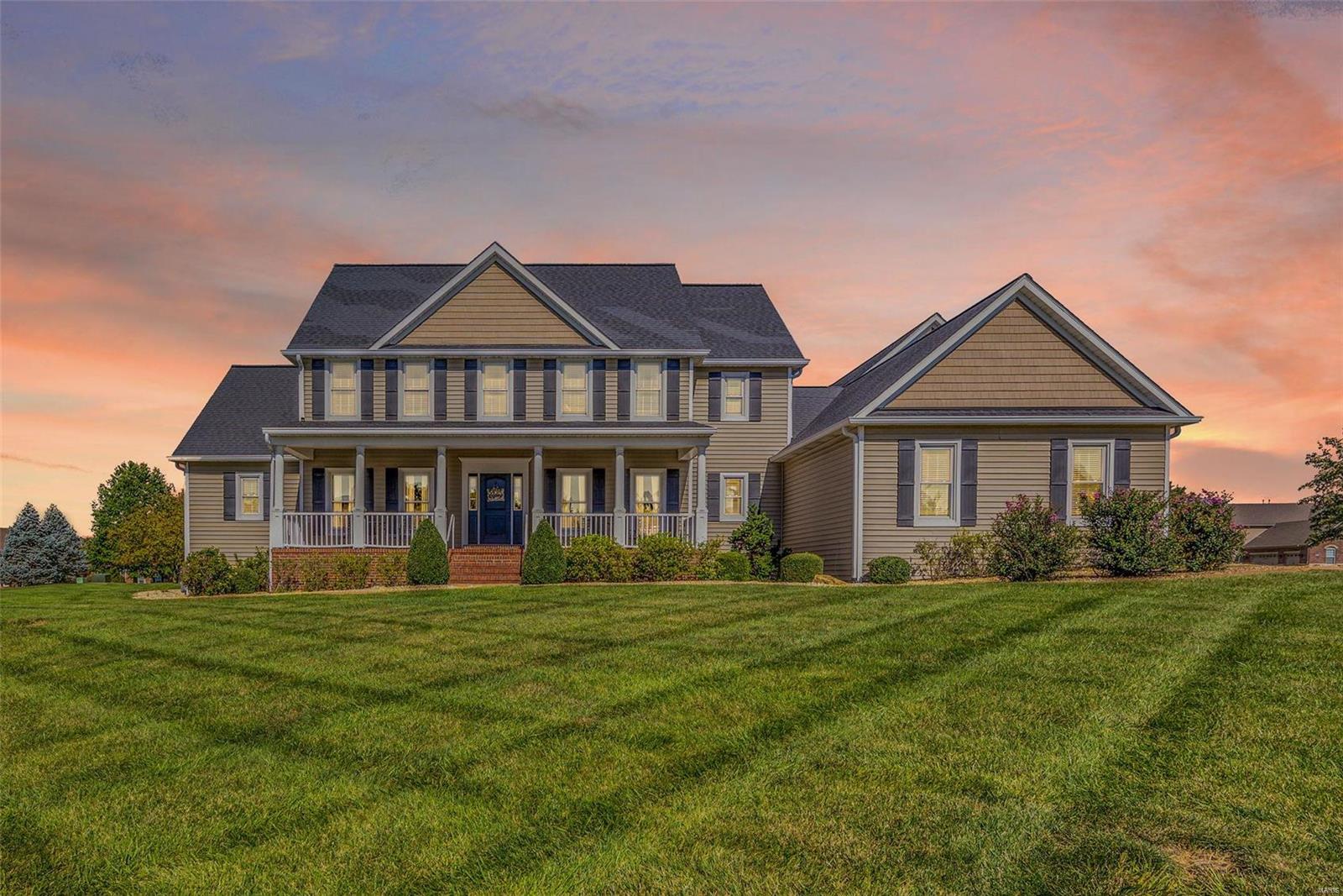 Welcome to this stunning 1.5 story home with the perfect floor plan for entertaining. Step in from the covered front porch to an amazing view of the 1 acre lot through the wall of windows in the Great Room! Gorgeous Acacia flooring graces the Great Room & Kitchen. The Kitchen is truly the heart of the home, nestled between the Great, Breakfast and Rec Rooms, and offers custom cabinetry, granite counters, SS appliances and a spacious pantry. The expansive Rec Room features a vaulted ceiling, a dry bar and adjoins the spacious, comfy theater room. Impressive, custom Laundry Room! The Master is tucked away from the main living spaces offering privacy and a spacious en suite with a whirlpool tub & walk-in shower. Additional MF spaces include two home office spaces and a formal Dining Room. The upper level features three large bedrooms and two full baths. The level lot provides the perfect blank slate for a future pool! Plenty of parking with a four-car garage and circle driveway, too!