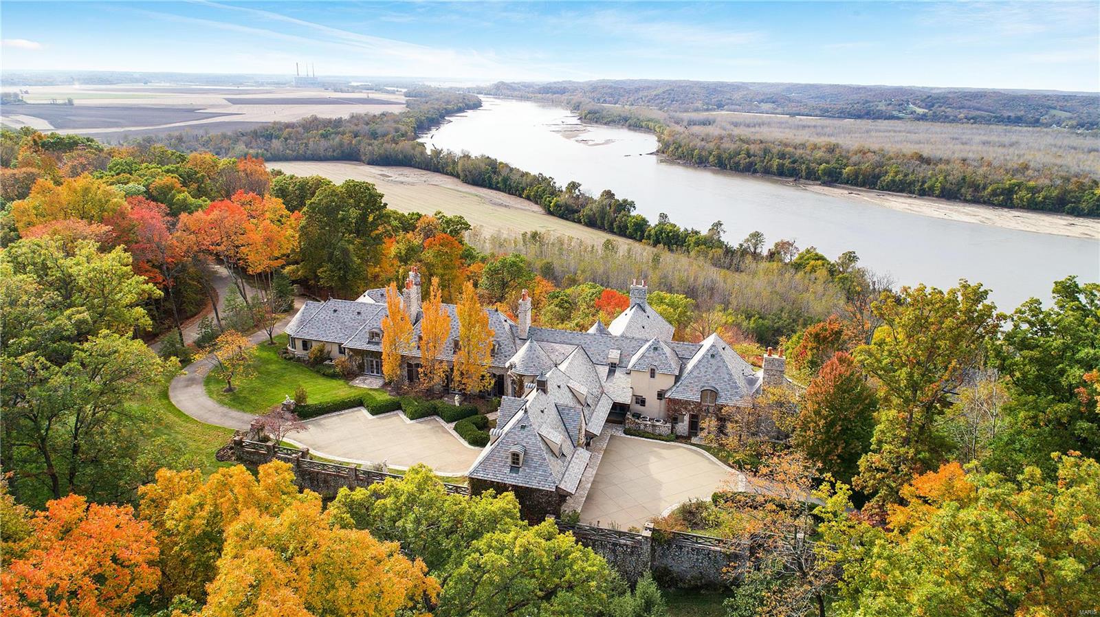 Historical, authentic, elegant, magical. Words that describe "La Charrette" a stone built & slate roofed breathtaking Country French Chateau set on 15+ acres overlooking winding vistas of the Missouri River. Designed by renowned architect, Jack Arnold. Built by the owner of a major STL construction company as his personal home, & as the perfect showcase for American antiques & historical furnishings & collections.The quality & features in this amazing property exceed the highest standards for construction & excellence. The photos do not do the views nor the home justice. With its open floorplan and cozy spaces, outdoor pavilion patio, covered veranda, perennial gardens & Butler's prep kitchen, this home lends itself perfectly to entertaining. Host to a wedding & many events, this home has 6 ensuite bedrooms & an authentic 1820's log cabin on the property that can be the perfect guest house. All exterior exposed wood is Redwood. The interior trusses are made from 800 yr old Douglas Fir.