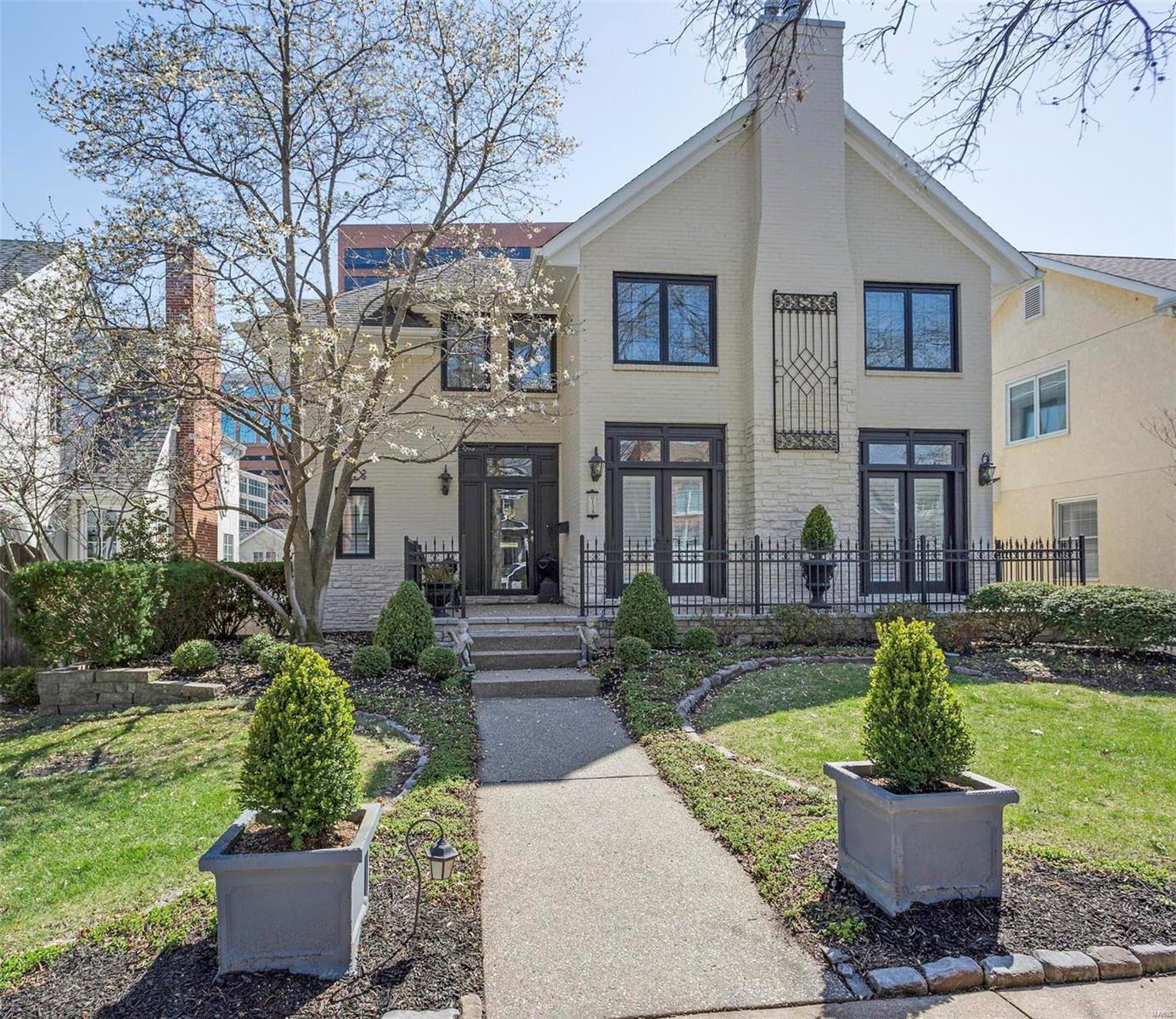 Showings begin Fri 4/20.QUALITY,LOCATION at its BEST! Stunning 2-story home in Desirable Clayton Gardens.10' ceilings on first floor with crown moldings, coffered ceilings in 1/2 bath & DR. Custom millwork and cabinetry throughout.Plantation shutters.Stunning LR has fpl and french doors. Family room w/ fpm & custom book cases. Sliders to custom deck with Azek floor and metal detail with pergola, fan and electronic shade.Special ceiling under deck for 3rd car. Gourmet Kitchen with customized cabinetry,subzero, granite counter tops.  Accessible elevator for all 3 floors.4 gas fireplaces. Large Master bdrm suite w/ fireplace,2 walk-in closets w/ built-ins.Master bath has large marble shower & jetted tub w/ many cabinets. One of the bdrms on 2nd floor is used as a study but can easily be a bedroom. Media room in the basement has a murphy bed. Rec Rm has wet bar, wine refrigerator, ice maker. Access to beautifully landscaped fenced back yard w/ hot tub. Electronic gate. Come tour this gem!