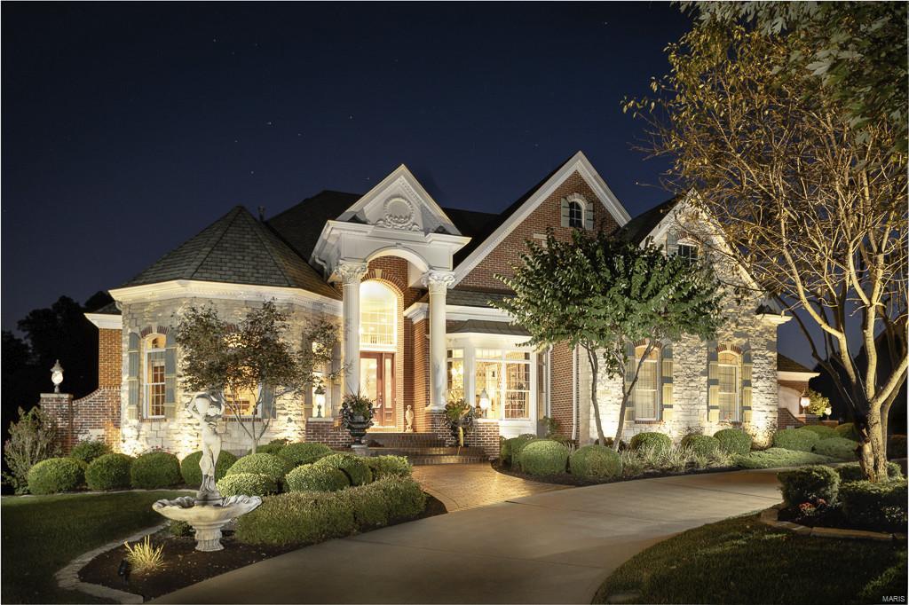 This absolutely stunning custom 1.5 story sits on a breathtaking lot with inground pool. As you enter the 2 story entry with curved staircase and limestone floors you will find a library/den with French doors and a large dining room, perfect for entertaining. The 2 story great room has a fireplace and built in bookcases. The kitchen is the heart of the home with ceramic tile floors, granite countertops, stainless appliances and butlers pantry which adjoins the breakfast room. You also find a hearth room with stone fireplace, built ins and bay window. Incredible master suite on the main floor with sitting room with fireplace. Luxury master bath. On the upper level you will find a loft/family room and 3 generous sized bedrooms and 2 full baths. Deck, 4 car garage & circle drive and so much more.