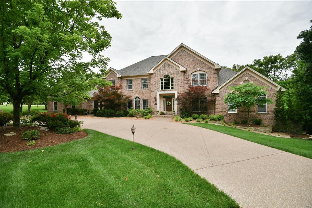 FABULOUS PRICE REDUCTION! Stately custom built 1.5 story home situated on 2.34 acre park like yard. Over 7000 square feet of fabulous living space. Open floor plan. Elaborate archways and crown moldings. Attention to every detail. The main level includes a soaring 2 sty gracious Foyer, Den/Office and Dining Rm. The 2 story Great Rm. features a fireplace and wet bar. The Gourmet Kitchen, Breakfast Rm. and Hearth Rm. overlook the pool and expansive backyard. A Bonus rm. makes a cozy reading rm. There are two half baths as well. The Master Bed rm. suite boasts a fireplace and tray ceiling. The bath includes a jet tub, separate shower and dual vanities. There is a front and back stair leading to the upper level complete with 4 Bedrms and 3 Full Baths. The walkout lower level features a Rec Rm. with fireplace and wet bar. Game Rm. Sleeping Rm. Exercise Rm, and full bath with shower. The highlight is the 1800 Bottle  Wine Cellar. Loads of storage. Amenities too many to mention! 4 car garage.
