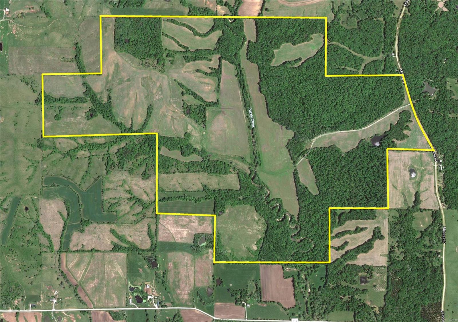 Amazing hunters retreat and income property! Whitetail deer, turkey and quail abound in this diverse habitat. Multiple Boone and Crockett trophy bucks and Pope and Young class deer harvested annually from 8 shooting houses and 30 deer stands. This scenic property consists of 710+/- acres of rolling hills, bottomland and marketable timber in Macon and Chariton County. 217 acres of CRP and 110 acres of crop (approx $45, 000.00) yearly. This property includes 6 ponds and 1 small lake stocked with Bass and Crappy. Puzzle Creek runs through the property and provides grass field borders excellent for quail. A must see for hunters!