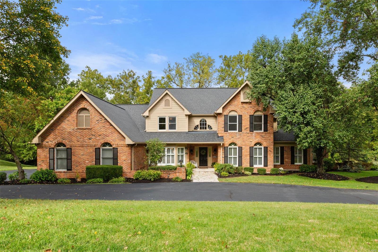 This fabulous 5 bed |6 bath checks ALL the boxes! 2-story entry foyer leads to dining room and sunken study. 2 story great room includes handsome wood-burning fireplace & wet bar w/ pass through service from the kitchen- fantastic for entertaining! Vaulted breakfast room leads to light-filled family room which opens on to deck. A paneled den leads to the primary suite w/ 2 WICs & serene bath w/ stunning views from the oversized jacuzzi tub. Formal powder, Laundry, add'l half bath & 3 car garage complete the 1st level. Front/back stairs lead to 2 secondary bedrooms w/ JNJ bath and an oversized ensuite bedroom.  Finished LL w/ kitchenette and bar offers an abundance of natural light & includes a fireplace, multiple rec areas, 5th bedroom & full bath w/ pool access. Gorgeous brick paver patio with outdoor fireplace leads to the pebbletec, saltwater pool. Surrounded by mature trees & lush landscaping, this backyard is truly a private retreat. 
Showings begin 10/4 at 10am
