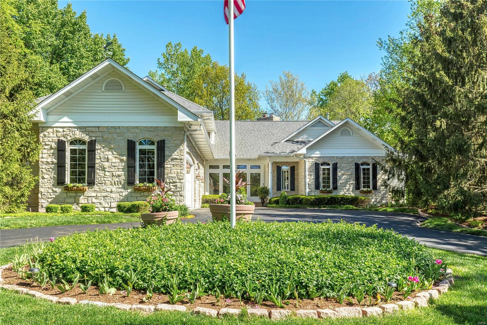 Spectacular stone 1.5 Sty beautifully renovated & redesigned! Open floor plan features hardwood & slate flooring, expansive windows, custom built-ins & integrated sound system. Impressive slate foyer leads to paneled study with beamed ceiling & built-in bookcases & vaulted great room with floor-to-ceiling fireplace & gathering bar. Exceptionally large kitchen with 42” maple cabinetry, granite countertops, premium appliances & 9’ center island adjoins light-filled dining room & hearth room with wide plank pine flooring & full-height fireplace. Sumptuous master bedroom suite combines the enjoyment of a stone fireplace with customized walk-in closet & marble bath. The 2nd floor extends the living quarters with 3 additional bedrooms, 1 with ensuite bath & 2 with Jack n’ Jill bath, plus bonus room. Lower Level includes game room, media room, 2nd kitchen, workout room, guest suite & wine cellar. Atrium doors open to outdoor living room with fireplace & pool surrounded by landscaped gardens. Additional Rooms: Wine Cellar