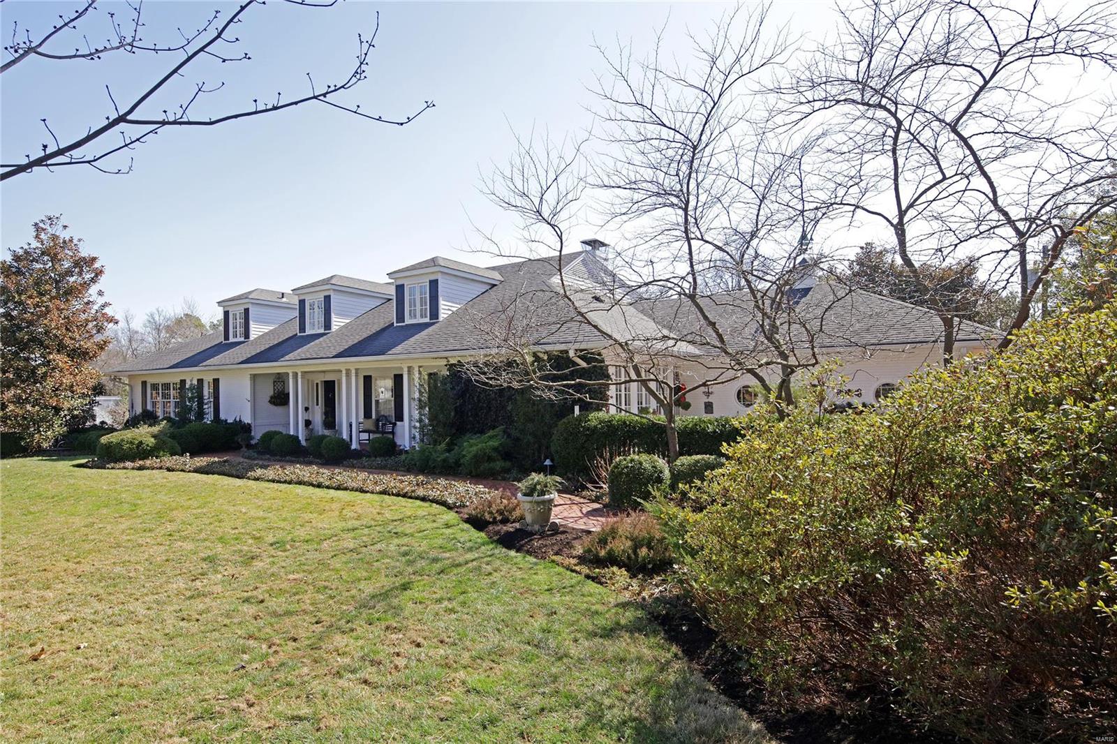 This home is charming!! From the gracious front porch, walk into the entry hall that opens to a very spacious living room with large windows and a gas fireplace. There is a formal dining room and a white kitchen with a cozy breakfast bar. The family room has a gas fireplace, wet bar and French doors opening to the large deck with a pergola. The sunroom is a delightful retreat that opens to the front porch and also a brick patio. Completing the first floor is a wood paneled library with built in bookcases and the master bedroom with a generously sized bathroom. Upstairs are three bedrooms, one with an ensuite bath plus a hall bath for the other two bedrooms. The dormer windows create extra spaces along the long hallway. In the lower level, you will find an office, lots of extra storage, a half bath and a large laundry room. Plantation shutters, dental moldings, some radiant heated floors and beautiful hard wood floors are just a few of the amenities that help make this home so special!! Additional Rooms: Sun Room