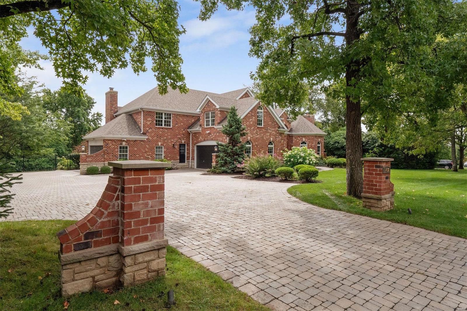 Secluded on 1.17 acres, this exquisite property offers resort amenities and rolling tree-lined views. A sweeping stair reception hall  unites awe-inspiring spaces with arched doorways, soaring ceilings and windowed walls. The main floor hosts a chef’s kitchen, formal and casual rooms, and a large primary suite with a sitting room, spa bath, and a private terrace.  Additionally, the main floor boasts four fireplaces, two powder rooms, a mud room, a large deck and a four-car side entry garage.   Upstairs are two en-suite bedrooms, two Jack ‘n Jill bedrooms, a loft and a recreation room.  The lower level is an entertainer's dream, featuring a screening room, full kitchen & wet bar, arcade, and a wellness center with a fitness room, a bar/yoga studio and a steam room….all opening to a private pool complex with an inground pool, spa, a gas firepit and a pass-through to the bar. Meandering paths are canopied in nature, creating endless possibilities for entertaining and outdoor adventure!