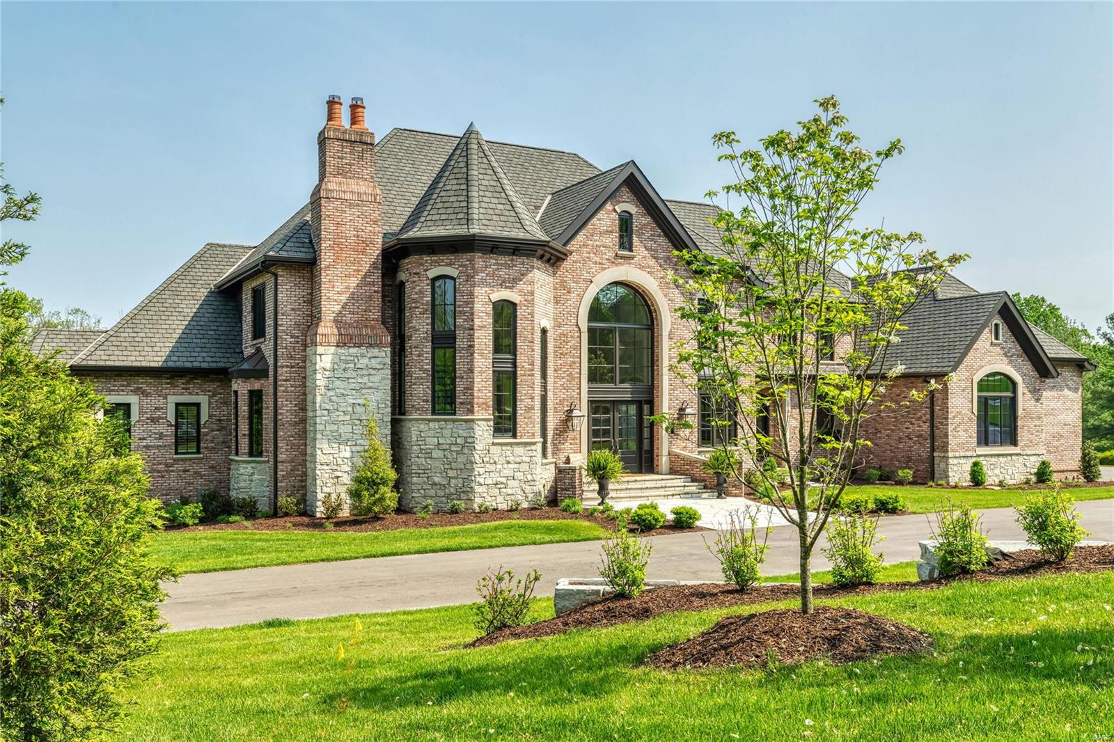 Homer Award-winning Estate home in premier Town & Country location. Grand 2-sty foyer with gallery landing & floating staircase leads to library-paneled study with fireplace & built-in bookcases, elegant dining room framed by architectural pillars & stunning great room with wet bar, 2-sty palladian windows & fireplace. Designer kitchen with quartzite countertops & commercial grade appliances adjoins breakfast room with atrium door to screened porch & vaulted hearth room highlighted by floor-to-ceiling stone fireplace. Sumptuous master bedroom suite with sitting room, beautifully appointed marble bath & French doors to deck. Front & rear staircases access 3 additional ensuite bedrooms. Lower Level includes recreation room with fireplace & wet bar, game room, family room, 2nd kitchen, 5th bedroom & 1 ½ baths. Situated on parklike 2.8-ac grounds with deck, patio with grilling station, outdoor living room with full-height fireplace, sport court, resort style pool & spa. Additional Rooms: Mud Room