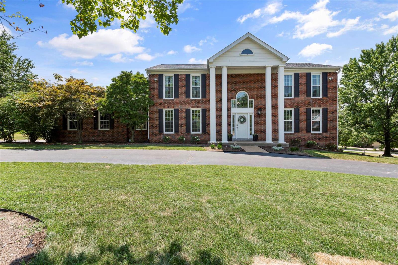 A beautiful Town and Country 2-story home offers it all! Renovated from top to bottom this home has been lovingly redesigned to provide a blend of traditional elegance with modern conveniences. Upon entering the house you will be greeted with a bright two story foyer. The center floor plan has a separate formal dining room and living room. Next, the vaulted family room has a cozy gas fireplace with easy access to a gorgeous patio, covered porch, and outdoor kitchen. The heart of the home is the kitchen with quartz countertops, high end appliances and a large 10’ island. Upstairs you will find 3 bedrooms and a full hall bath. The primary bedroom features a peaceful en-suite bathroom with a large soaker tub, heated floors and walk-in shower perfect for escaping the stress of the day.The fully finished lower level has a large recreation room with storage galore, full bath, kitchenette and bonus room. This home is located in a beautiful tree lined neighborhood close to both HWY 270 and 64.