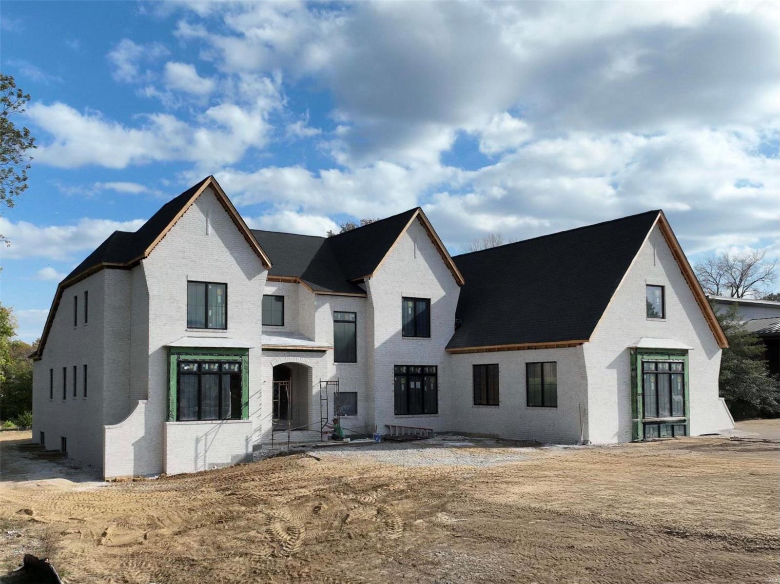 Now UNDER Roof. 1-acre lot on Claymark, this transitional-style custom beauty spans nearly 7,000 sqft of luxurious living space with options for customization. The grand 2-story entry foyer opens to expansive sight lines, leading to a sumptuous master suite with a large walk-in closet and spa like bath. The main level boasts 10-foot ceilings, wide plank hardwood floors, detailed millwork, an expansive kitchen with high-end appliances, and an oversized hearth room. An outdoor covered patio with a fireplace extends the living space outdoors. The main level also offers a convenient laundry room. Upstairs, airy 9-foot ceilings create a refined atmosphere in three bedrooms, each with ensuite baths, plus additional rec-space and a 2cd laundry room. The lwlv is a dream, complete with a sophisticated wet bar and premium cabinetry. A 4-car side-entry garage adds to the home’s grandeur. This custom home perfectly melds elegance with practicality, offering a truly special retreat. Additional Rooms: Sun Room