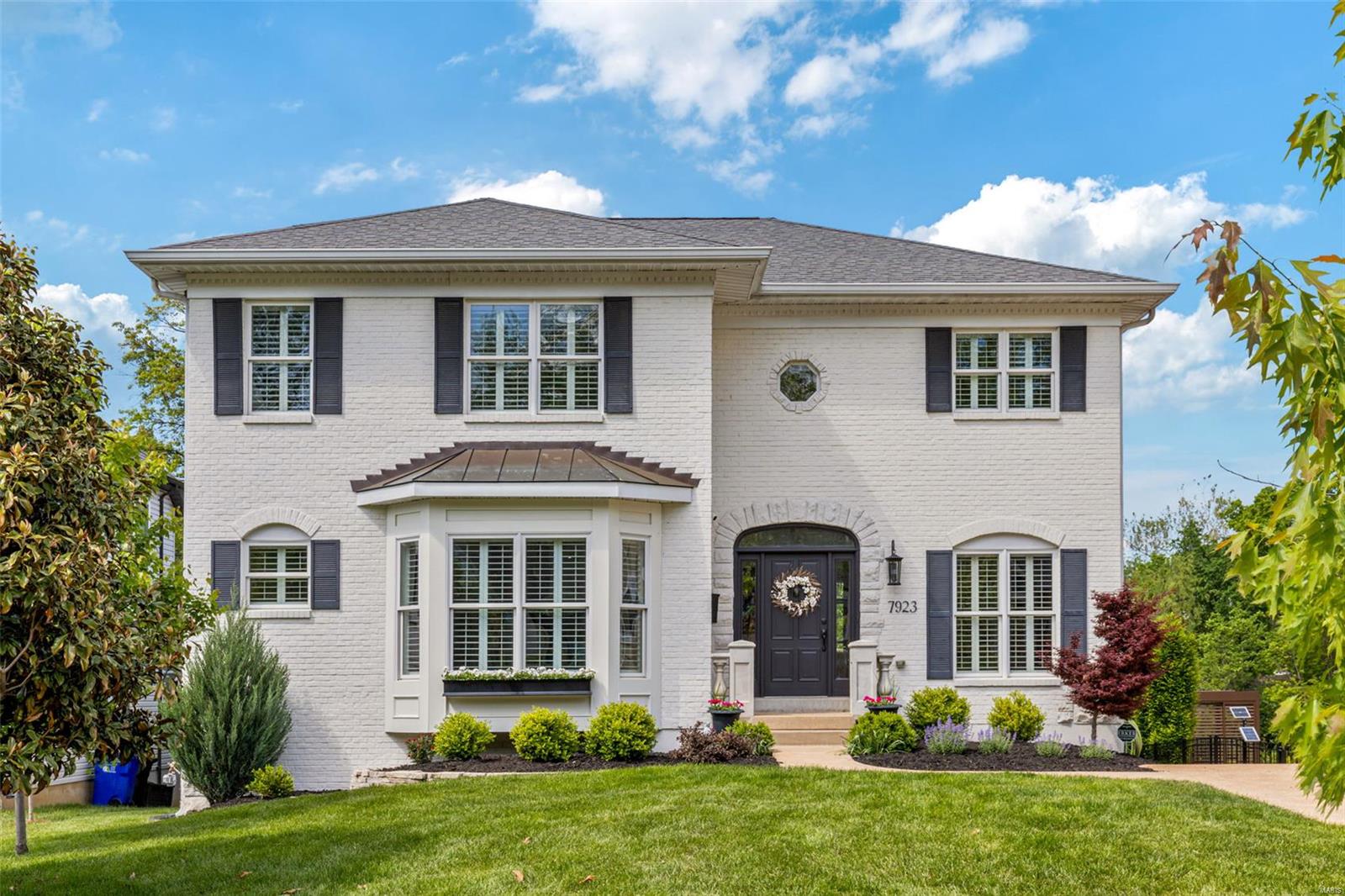 Professionally designed 2sty home showcases exceptional craftsmanship & thoughtful details throughout. The inviting entryway passes a private office with pocket doors & opens to a spacious living room featuring a wall of windows, a fireplace with a handcrafted mantel, & built-in bookcases. The designer kitchen is a standout, w/ 42” white inset cabinetry, quartz countertops, 8-foot center island, & butler’s pantry with wine cooler. Just off the kitchen, a fully covered deck offers privacy & overlooks the large backyard. Upstairs, the expansive primary suite includes a clawfoot tub, a generous shower, & dual walk-in closets. The 2nd level also features a bedroom with an en-suite bath and 2 additional bedrooms connected by a Jack-and-Jill bathroom. The walkout lower level opens to a private patio. Set on a .3-acre lot w/ a two-car garage, this home offers the comfort of newer construction in a highly sought-after location— walking distance of parks, restaurants, & coffee shops.