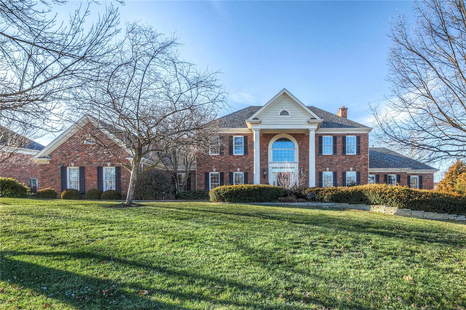 This beautiful home is move in ready with lots of attention to all the details. Tastefully updated throughout with neutral colors and quality features. 2 story entry with formal DR and Office. Kitchen/hearth has been updated with newer island, counters, wolf cooktop, stainless appliances, dual sinks, faucets, hardware and opens to breakfast room and hearth that has a vaulted beamed ceiling with wood inland planks. The master has also been totally upgraded with wood flooring and raised coffered ceiling.  Glamour master bath with all newer cabinets, floorings, fixtures, along with a great walk in closet fully outfitted with custom shelving. Upstairs there are 3 bedrooms/2 baths and loft area with built in desk/closet. The WO lower level is perfect for entertaining with a large walk behind bar with custom cabinets and counter, large rec room, office, workout room, full bath. Upgraded moldings throughout. Park like rear yard with patio at kitchen and lower level. Pergola over dining area.