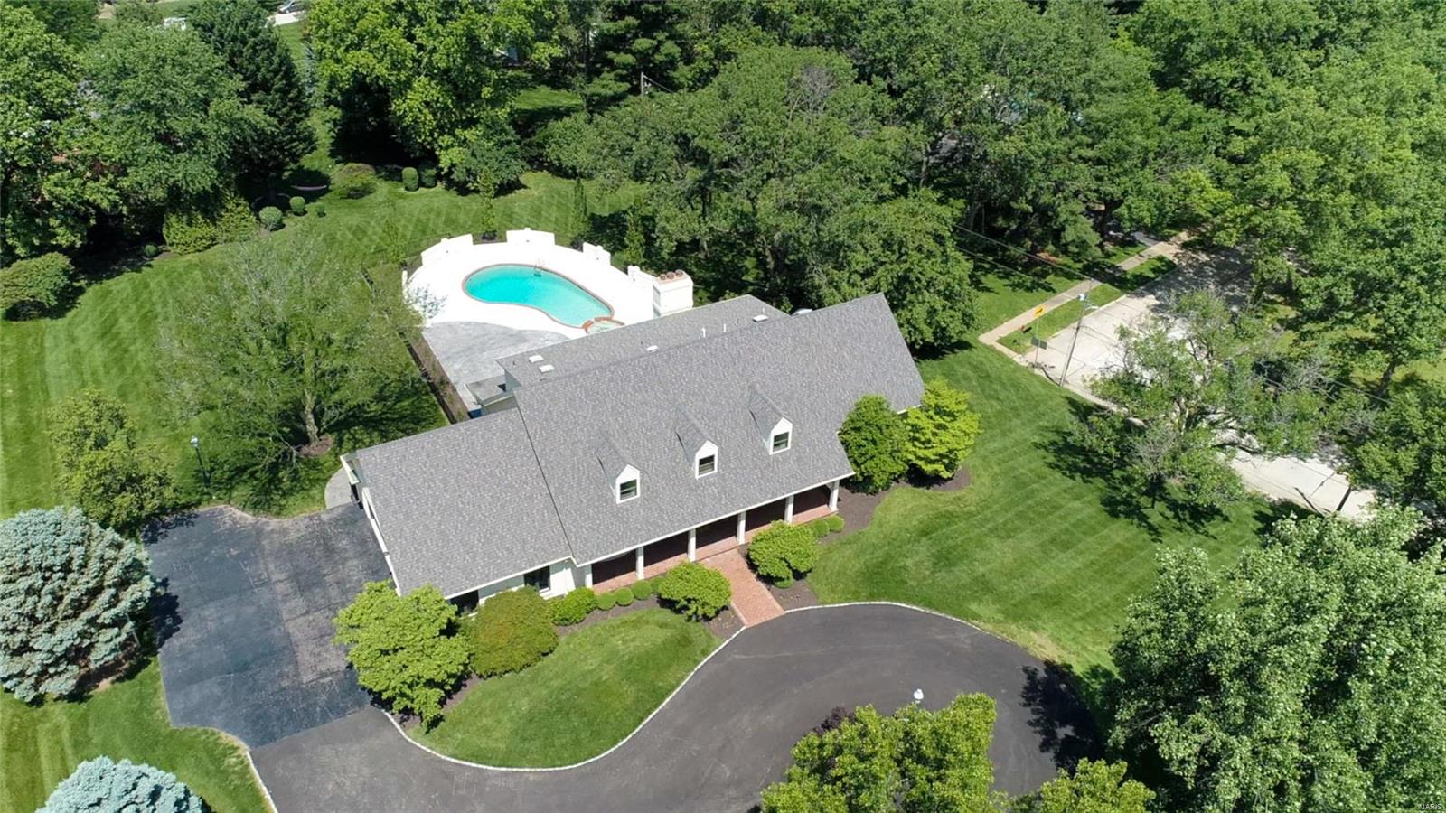 REDUCED PRICE!  Absolutely beautiful 6791+ sq ft Town & Country, home-totally renovated. The 7 bedrooms, 4+ baths,  is a real show-stopper! Two-story foyer welcomes you to a bright spacious dining room and living room. Hardwood floors on all three levels. A stunning eat-in kitchen with a quartz waterfall island, is a chef’s delight.  New custom cabinets, butler’s pantry, and top-of-the-line appliances. Looking out the bay window, you'll see an in-ground pool with an adjoining hot tub. The family room has built-in bookcases, vaulted ceiling, and a gas-powered fireplace. The master bedroom on the first floor with a spectacular bathroom, walk-in closet, and laundry room.  Second floor -  6 bedrooms, 2 full baths, and a new laundry room. The LL has a full bath, fireplace, exercise room, and new French doors that take you up to the pool area. 3 car oversize garage, new landscaping, and an asphalted circle driveway. “Shield Plus”–American Home Shield Warranty & $4000 closet credit. Additional Rooms: Mud Room, Sun Room