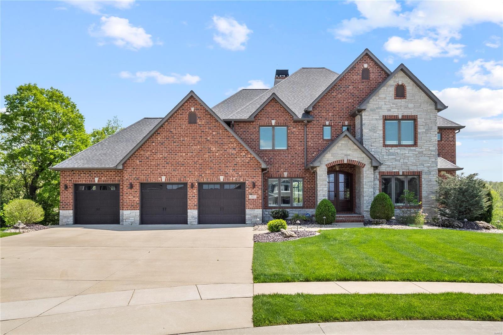 RARE OPPORTUNITY TO OWN THIS CUTOM-BUILT BEAUTY ON A 1.5 WOODED LOT W/ LAKE ACCESS! Boasting nearly 6,000 sq ft of living space, this stunning 1.5-story home impresses from the moment you step into the marble foyer.  Soaring ceilings, floor-to-ceiling stone fireplace, gourmet kitchen w/custom cabinetry & an open layout create a perfect setting for both entertaining & everyday living. The main floor primary suite offers private deck access & a spa-like bath w/ tiled shower, heated floors & a spacious walk-in closet w/ built-ins. Upstairs, you'll find two generously sized bedrooms connected by a jack'n jill bath, plus a third bedroom w/ its own private bath. The walk-out lower level is loaded w/extras-exposed beams, second fireplace, home gym, custom bar, cooled wine cellar, bonus room & plenty of storage space! Nestled on a cul-de-sac in the desirable Reserves of Timber Ridge, this home won't disappoint! Other features include geothermal, fenced in yard, oversized 3-car garage & more. Additional Rooms: Wine Cellar