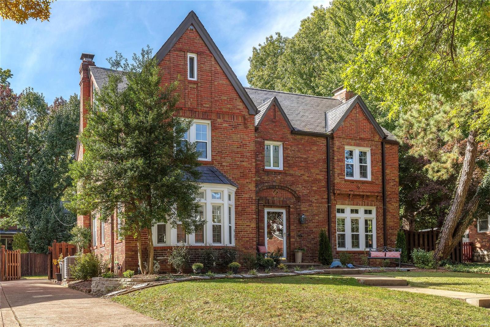 Recognized as a Ladue News "Distinctive Property", a spectacular extensive renovation of this impressive 2.5 story Tudor style home has just been completed. The beautifully landscaped yard and the charming curb appeal give you a hint of the wonderful surprises that await you inside. The upscale chef's quality kitchen has been rebuilt from the studs up and has extended counter space. Beautiful architectural details throughout include high ceilings, rich refinished wood floors and two impressive fireplaces. A light filled sun room opens to the private fenced back yard with a patio and small decorative pond with waterfall. The second floor boasts the master bedroom suite w/updated ensuite bathroom,3 more bedrooms, another sun room,and a full hall bath with 2nd floor laundry.The finished 3rd floor features a 5th bedroom,3rd full bath,and large carpeted family room. The lower level includes a recreation room w/ fireplace,bar,and half bath. Attached rear entry 2-car garage. Lots to love! Additional Rooms: Sun Room