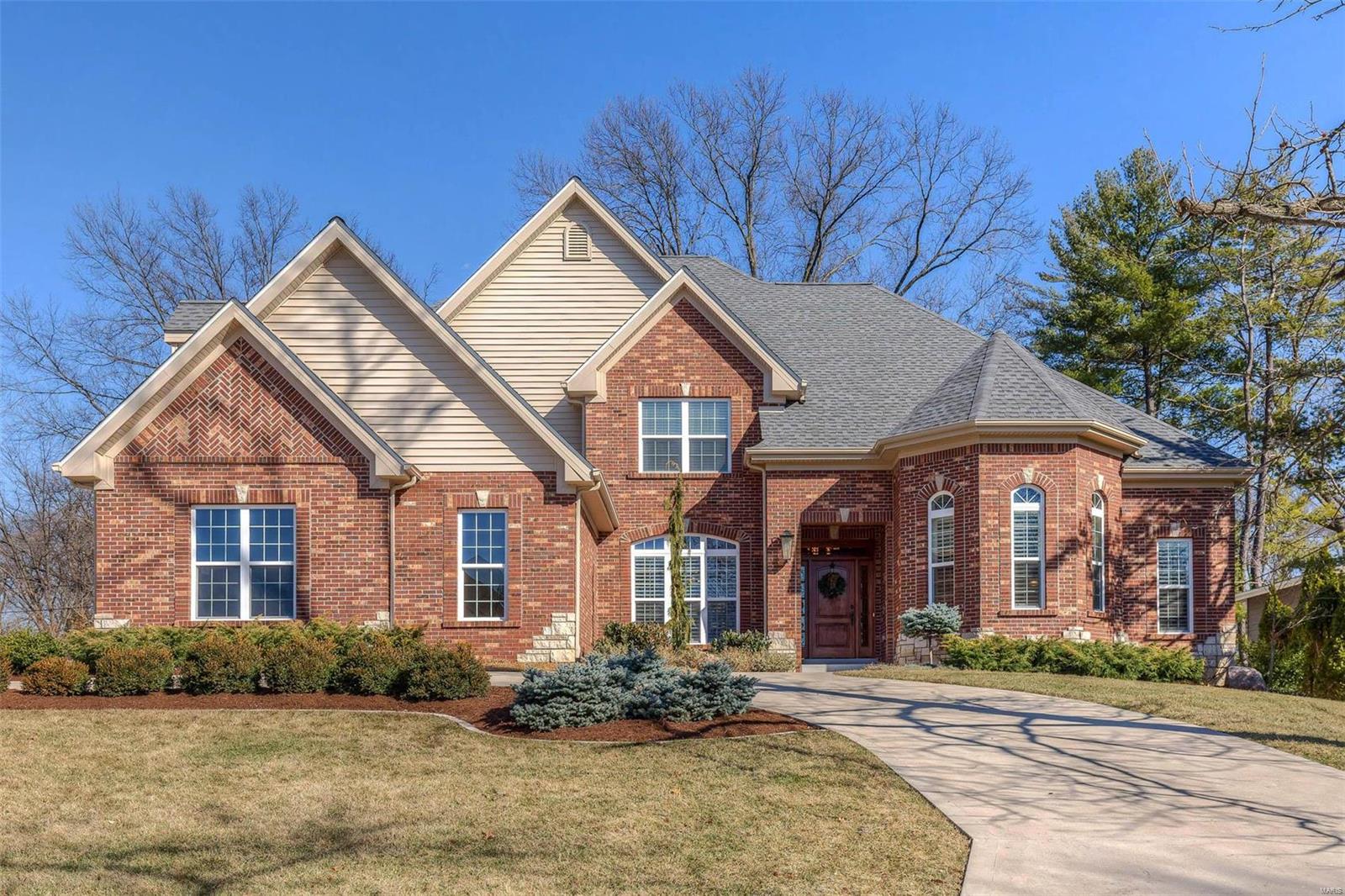The road less traveled in Harwood Hills, is where you will find this lovely home that’s both sophisticated & comfortable. Soaring ceilings & beautiful wood floors compliment the rooms that flow effortlessly, creating great spaces in which to entertain. The kitchen in the round opens to the breakfast room, with a wall of windows & is flanked by two gathering spaces that feature stately stone fireplaces. Within the kitchen you’ll find granite, SS appliances and a breakfast bar for additional seating. There’s no shortage of counter or cabinet space! A box bay window lets the sun shine into the 1st floor master suite with a large walk-in closet. Four ensuite bdrms are found on the second floor plus a bonus family room that is ginormous! The lower level offers expansive space for games, exercise areas and a wet bar that is adorned with exotic granite & stone. There’s room to create a 6th bdrm in the LL if needed. Walkable to the Kirkwood schools.Convenient to shopping, highways & hospitals. Additional Rooms: Mud Room