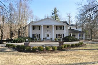 Privacy and serenity are the hallmarks of this picturesque three-acre property in the center of Ladue. This gorgeous piece of land hosts a beautifully appointed   4 bedroom, 5.5 bath home featuring a newer custom kitchen with chef’s stove, double refrigeration - freezer systems ,  including refrigerated drawers, granite counter tops, custom cabinets, wine refrigerator, breakfast bar, and grand sized dining space. The large kitchen opens to a hearth room that over looks the beautiful grounds. This space boasts a gas fireplace, wet bar, lighted cabinetry, entertainment and sound systems. The spacious, finished walk-out lower level with wet bar, wood-burning fireplace and full bath opens to a large patio and pool with waterfall feature.  Enveloped within expansive grounds is a gazebo, pond , and wildlife galore, providing a park-like setting with breath-taking views.