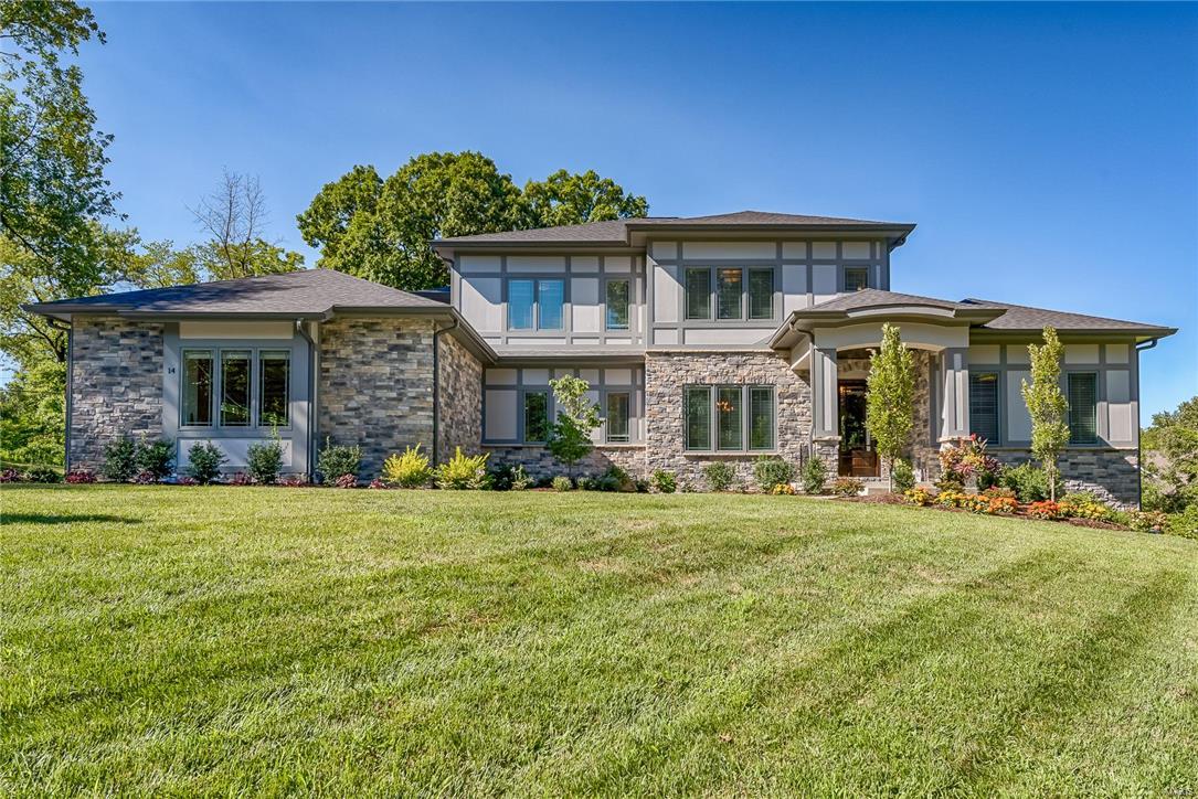 ANOTHER SPECTACULAR PROPERTY by MARK S MEHLMAN HOMES. Perfect 5BR/5.5BA, 1.5 story Prairie-style in cul-de-sac on a private Ln. Thoughtfully designed by Lauren Strutman, enjoy natural-light and beautiful views from all rooms. Entry flanked by study & formal dining. Incredible family room with 2-story vaulted ceiling & stacked stone gas FP w/floating mantel is the heart of the home. Center island eat-in gourmet kit w/breakfast bar, custom cabinets, granite, Wolf/Subzero, 5 burner cooktop, butler’s pantry w/bev cooler. Master suite has an elegant Bath w/ coffered ceilings, oversized shower & free standing tub w/huge custom closet. Upstairs are three ensuite bedrooms w/custom closets and 2nd laundry. High-end finishes include 3 car gar, custom Pella Windows, Mahogany entry door, 10’ 1st floor ceilings, zoned HVAC, irrigation system, alarm. Finished LL walk-out with 9’ ceilings, full-height windows, wet bar, fplc, 60” TV, BR and full Ba.  Ladue Schools. Fenced backyard perfect for a pool.