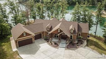 Stunning custom home built in 2016 w over 4200 square feet of living space. Located on Alpine Lake, Innsbrook Resort’s largest lake. Enjoy lakeside living at its finest. Captivating views from almost every room. Easy lake access w gentle slope to the beautiful long stone seawall at water’s edge giving easy access for all water activities. Perfect for entertaining family or friends year round. The attention to detail is beyond imagination. It truly is a must see to appreciate all from strategically placed windows to Triangulo exotic wide plank wood flooring to the auto-sensor stair lighting to chef’s delight kitchen w to die for pantry, to the four Season Rm & the 3 car oversize garage for all the toys one might acquire. This home is ideal as a primary residence or secondary getaway w low exterior maintenance or upkeep providing more time for relaxation, recreation & enjoyment of all Innsbrook Resort has to offer. Special Features List is available to see what is instore for you. Additional Rooms: Mud Room, Sun Room