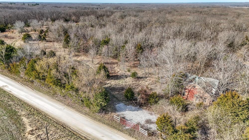 Looking for a great hunting property with a place to build? This is it! This awesome farm has been under intense trophy whitetail management and is absolutely jamming with deer and turkeys. The habitat is a mixture of timber, brush, and cedars - bordered by row crops. Multiple creeks run through property making for a nice water source. It is the ideal set up for hunting monster bucks where they live before they head out to the crop fields at night. A strategic staging food plot is already in place with a Banks Stump 4 blind overlooking it. Several big mature bucks have been harvested out of this blind and featured on Drury Outdoors Bow Madness television show. The brushy field could be opened up even more if someone wanted a bigger plot or to convert it to row crops. Good build sites with electric running along the road. Excellent location! Super convenient and easy to get to from Interstate 70 and Hwy 61.