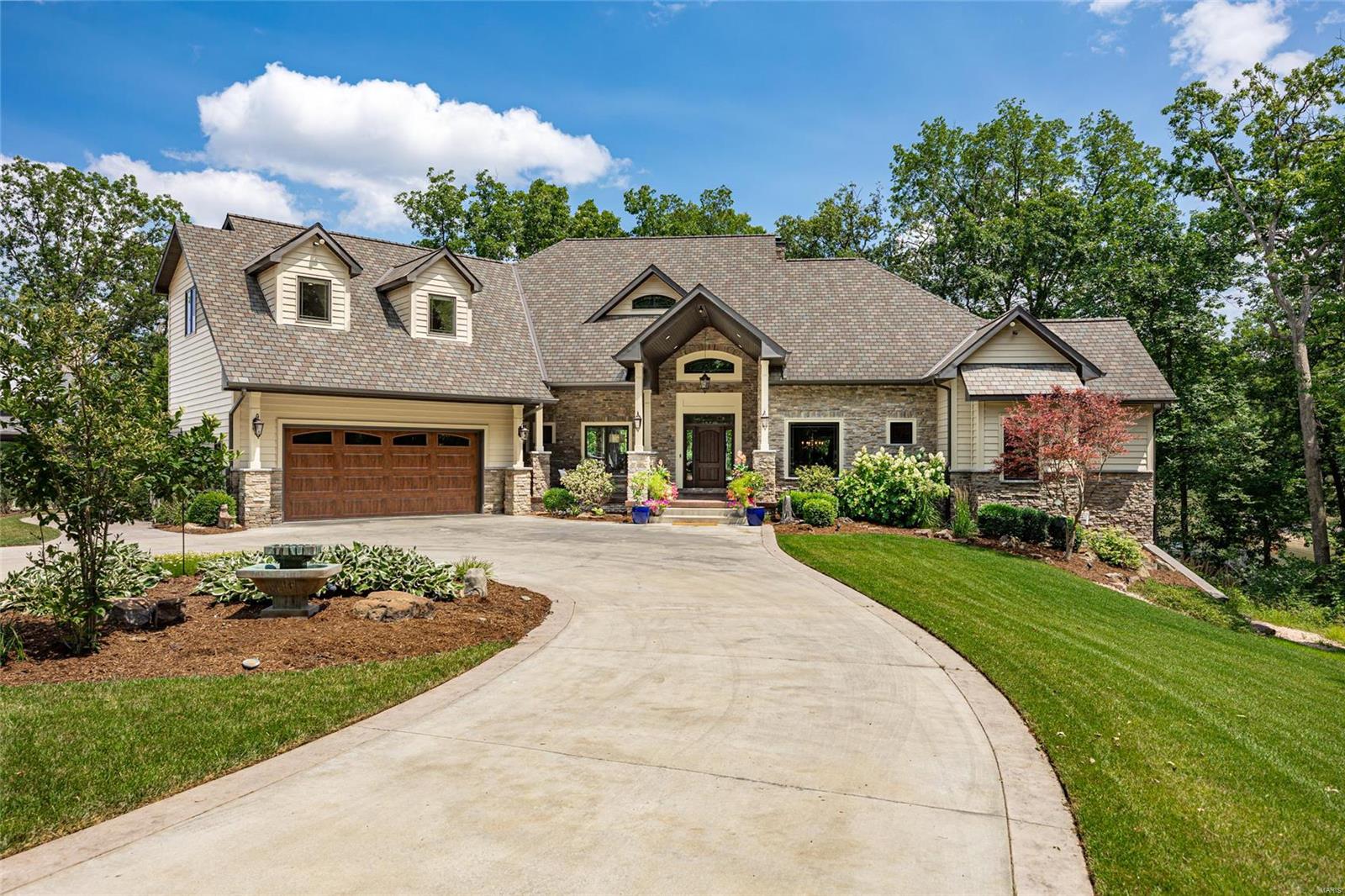 This Exquisite Home is located at the Best Kept Secret in Central IL, Lake Sara! This Extravagant 5 bedroom 3 full 2 half bath
Home is Ready for a New Owner! Attention to Detail at its Finest: from the moment you touch the property you will know this
isn't just an ordinary home. Step inside to see the Meticulous detail! Every Inch is Customized! From the vaulted ceilings, to
the beams, to the crown molding, to the Pella Windows and Doors, to the fireplace mantel, to the wood flooring and Everything
in between! An Abundance of Windows and Views! Open Concept living area, wide open to the kitchen designed for a chef,
pantry, B'Nook to the Covered Patio with outdoor Kitchen! Massive Master on Main! Laundry on Main! Second floor over garage
has 2 beds, a full bath, and separate laundry. The basement has 2 bedrooms, a bath, a gym, storage, AND a Bar with custom
top made from a tree on the property! Wine Closet! A Large TV Area! Heated Floor in Basement! A Boatdock with 2 slips! Additional Rooms: Wine Cellar
