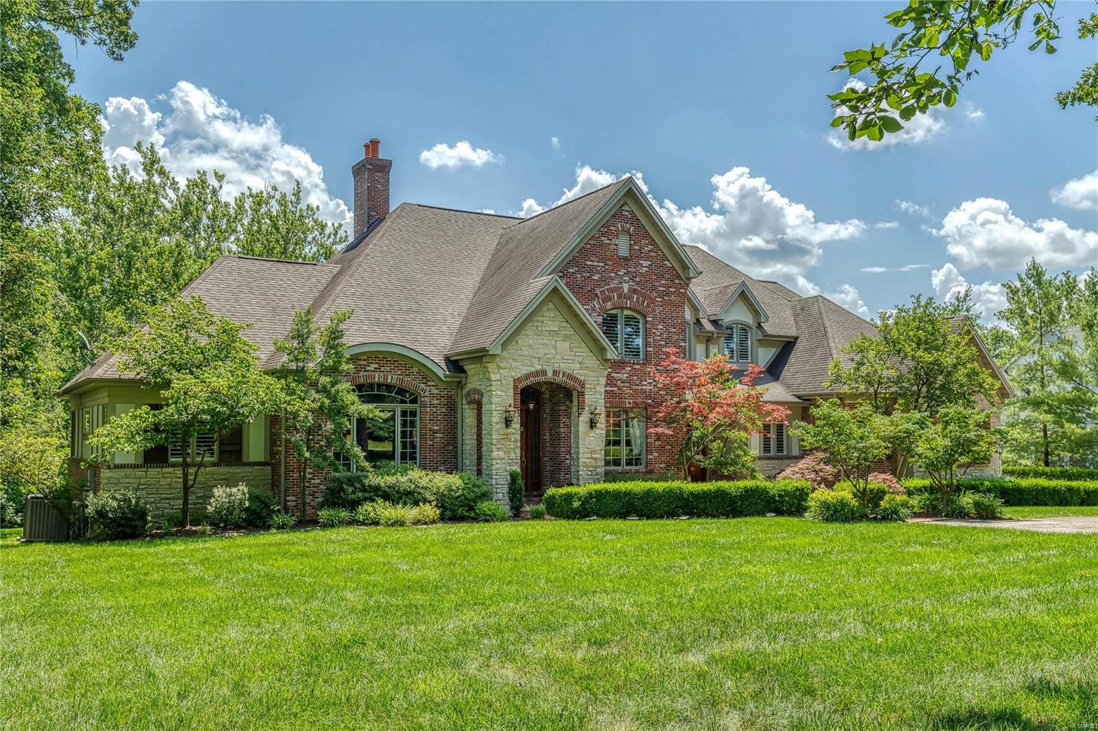 Elegant European-styled Estate home! Hardwood foyer leads to barrel-vaulted study surrounded by oak paneling, formal dining room & spectacular great room with cast stone fireplace, built-in bookcases & 2-sty wall of windows. State-of-the-art kitchen with marble & granite countertops, alder wood cabinetry, commercial grade appliances, butler’s pantry & planning center adjoins breakfast room with wet bar & sliding glass door to deck & vaulted hearth room highlighted by floor-to-ceiling stone fireplace. Coffered master bedroom suite combines the enjoyment of a stone fireplace with His & Hers walk-in closets & marble bath with jetted tub. The 2nd floor extends the living quarters with 3 additional bedroom suites & bonus room. Lower Level includes recreation room with wet bar & brick fireplace, family room with see-through fireplace, game room, office & full bath. Atrium door opens to outdoor living area with fireplace, grilling station & resort style pool surrounded by landscaped gardens.