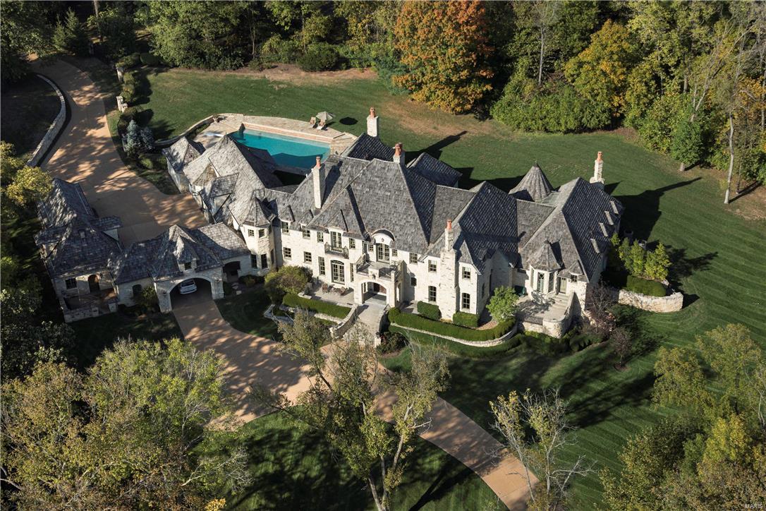 Major price adjustment makes the offering of this estate remarkable. Chosen by KDSK TV-5 for exceptional and incomparable design, indoor and outdoor spaces, the Dick Busch designed home was created to mirror majestic 18th century castles of France's Loire Valley. Constructed in hand-selected materials, the home provides optimum privacy on 3.4 acres. Lavish details include a two story dining room opening to a mezzanine level library, soundproof main-level theater, main level billiard room composed in English woods, forged ironwork, polished stone, artisan millwork, mantles and elaborate ceilings. Luxury details include vented cigar lounge, gaming room, wine cellar and gym. Chef kitchen. Main level Master suite. Terraces and patios surround manicured lawns. Full cabana serves pool and spa. The long, private drive exits past a five-car garage, to Log Cabin. Ideal large events and fundraisers. Millions more to replicate, impossible to recreate on such a resplendent setting.