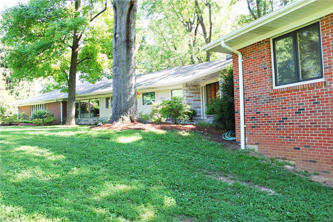 Meticulously maintained 5 bedroom/4.5 bath sprawling ranch in prestigious Huntleigh on a stunning 3.62 acre setting. Either upgrade some finishes to create a Mid Century showpiece or utilize the property as an opportunity to build your new dream home…the possibilities are limited only by your imagination. The home offers nearly 4000 sq. ft. of gracious living and entertaining space.  Highlights include gleaming hardwood, cove moldings, recessed lighting, built in bookcases and acres of windows opening to a truly private park like setting. Zoned for horses. The massive recently renovated chef’s kitchen features custom cabinetry, stainless steel appliances and granite counters. The light and bright walkout lower level with floor to ceiling windows is an unexpected bonus. Live in a country like setting yet be a stone’s throw from the area’s best shopping, restaurants and schools. An exceptional opportunity.