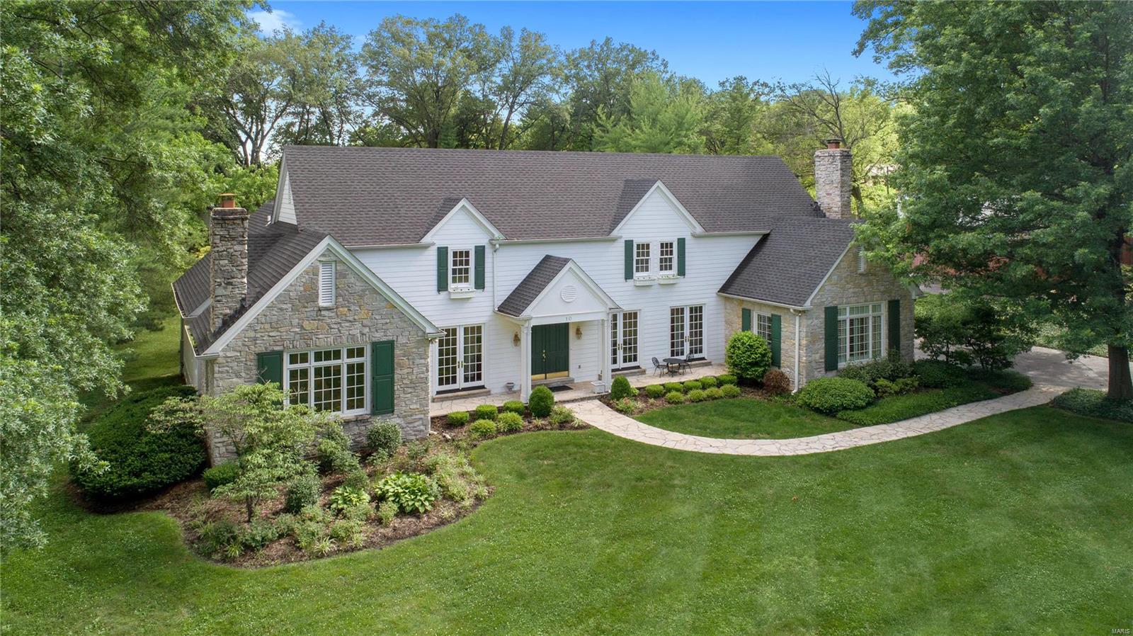 Exquisite Estate nestled on an acre of privacy with luxury features and updates throughout. Gallery entry hall lined with picturesque windows & french doors leads to sophisticated hearth room, formal dining room, and gourmet eat-in kitchen. Featuring custom cabinetry, large island, granite counter tops, double ovens, Viking gas cook top, SubZero refrigerator, & large pantry adjoins breakfast area. Stunning family room w/ custom mill work, stone fireplace, & top of the line wet bar/entertaining kitchen. Main floor master suite boasts large custom walk in closets and access to private back patio. Luxury master bath features his/hers custom vanities, marble counter tops, separate soaking tub & large shower. Second floor offers laundry room, 2 bedrooms joined by a  Jack and Jill bath and 2 additional bedroom suites. LL rec room, w/ half bath and ample storage. Handsome craftsmanship throughout. Large flagstone patio and separate deck. Equipped w/ an elevator, mudroom and 3 car garage. Additional Rooms: Mud Room
