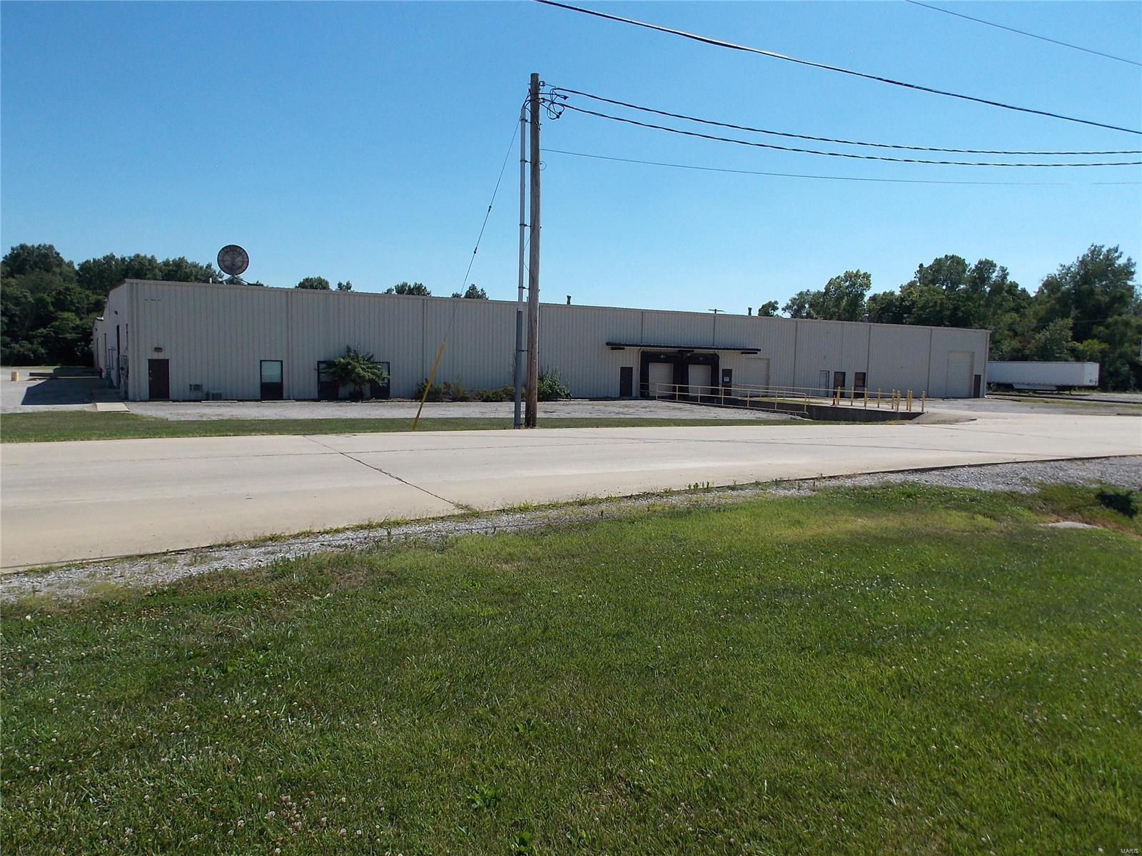 Commercial/ Industrial warehousing or manufacturing opportunity with 80,000 sq' consisting of two 160' x 240' Pre-Engineered Metal Building structures with connecting 60' x 56' structure for access between both and a 4-bay loading dock area with pit and levelers. The north or front building offers two additional loading docks with pit and 4 drive out overhead doors and over 1800 sq' of office space. The facility has 3-phase service, insulated and has a wet fire suppression system and gas forced air heating. The exterior offers service access, paved loading dock ramps and rock lot with 30 plus parking spaces. Location: Industrial Park, Industrial Area