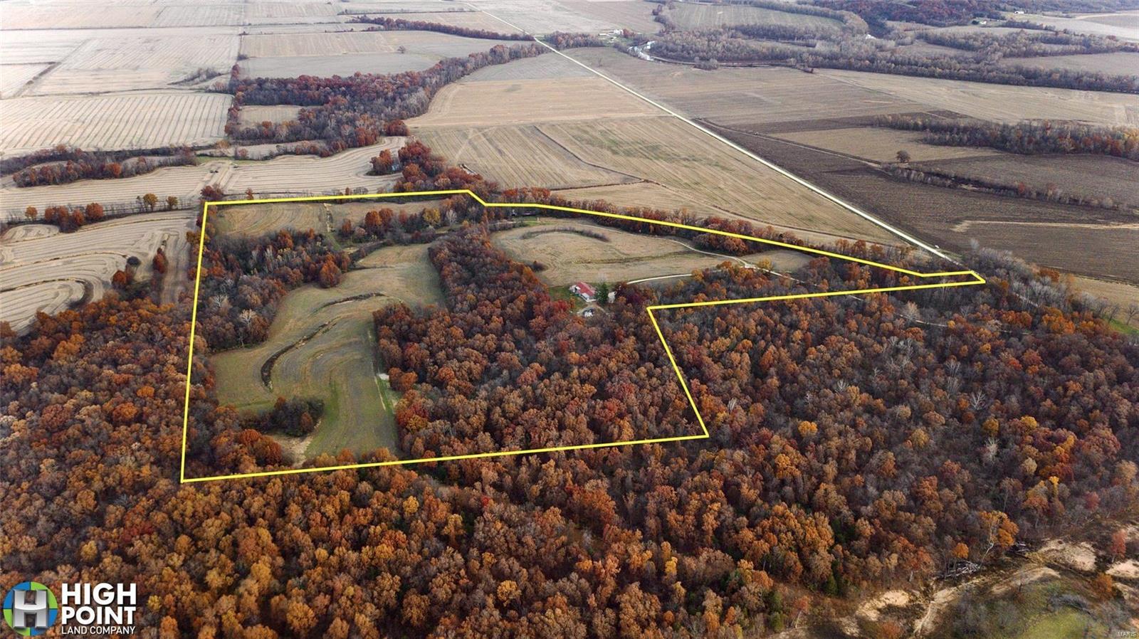 76 +/- acres overlooking the Salt River only 20 Miles North of Bowling Green and 1 Hour North of Wentzville, MO. Custom built in 2015, the stunning 4 bed 3 bath 3,000 sq ft single story home located high on the South end of the property, boasting a “million dollar view”. 8 total rooms, 4 bedrooms with 2 master bedrooms, 3 full baths, a screened porch with a hot tub offering a scenic view of the property, 18 ft above ground pool, storm shelter and much more! 32×32 3+ car garage with concrete floor, as well as an additional 16×32 garage designed to park your tractor, side by side, etc! Property consists of a mix of mature timber, row crops, and thick draws providing ample habitat for all wildlife! Boasting multiple stand locations for different winds, established food plots, 4 Millennium Tower Blinds, funnels, TSI, and access trails throughout, makes this turn-key farm extremely hunt-able. Approx 32 terraced tillable acres cash rented @ $150 per acre.