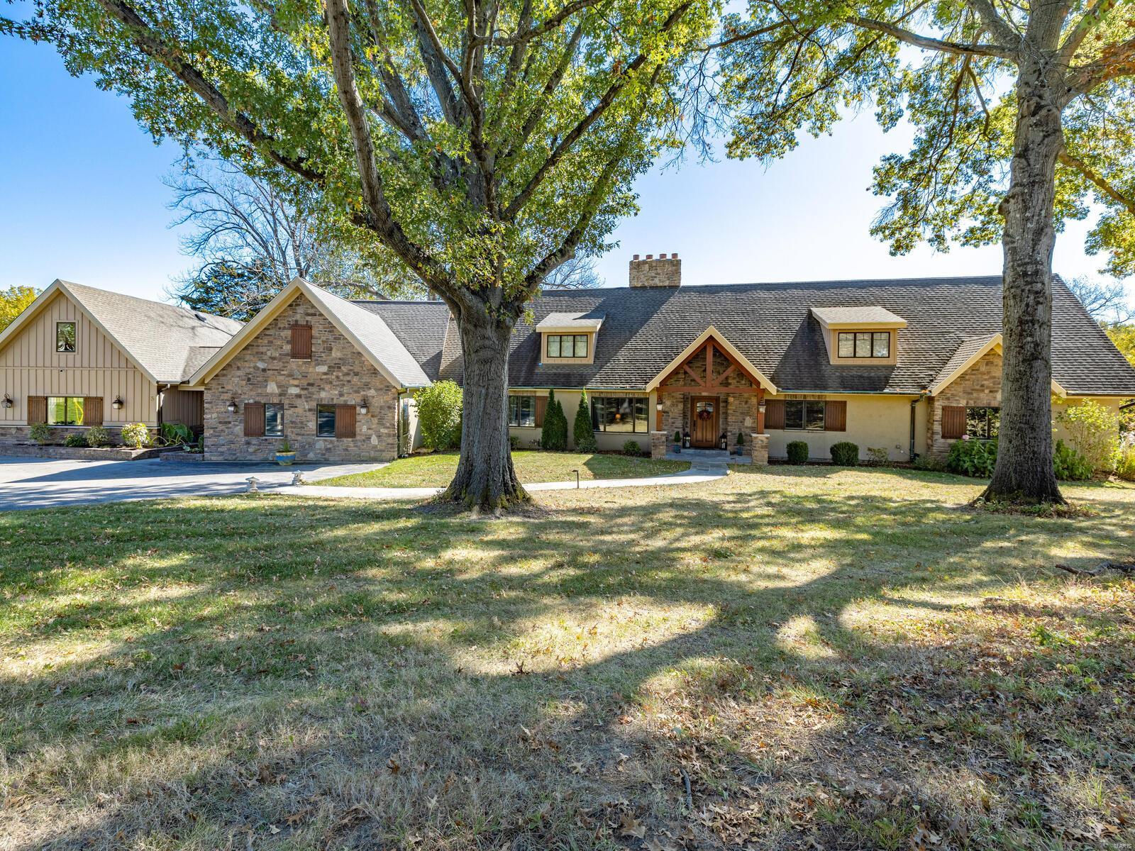 Queeny Park contiguous, modern, lodge-style home on 3 acres in Town and Country accessed by an exclusive private lane. Beautifully built in 2011 to take in the sweeping views of the grounds and park wildlife. 7 bedrooms, 8 bathrooms, a 4-car garage, and an expansive great room will luxuriously accommodate family activities, large gatherings, and entertaining with plenty of room to social distance safely. Bedroom, bathroom, and office above the garage with private entrance could host guests and be the perfect work from home location. Large professional quality gym/fitness center with full bathroom and private entrance could be easily used as another bedroom or office.  Extra building in rear includes a workshop, storage, tack room, and 2 stalls (used for horses, prior to seller's ownership). Additional Rooms: Mud Room