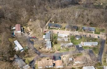Fantastic Opportunity to own a Well Established Multi Use Property on 13+ acres in Fenton Missouri. Three Apartment Buildings offering a total of 24 units consisting of 20 - 1 bedroom units and 4 - 2 bedroom units are just the beginning of this amazing property. In addition to the Apartments the property offers 11 Mobile Home Pads with several mobile homes included in the rental portfolio. The property has great growth potential with acreage available for additional Apartment Buildings or additional Mobile Home Pads to add to your income potential. Onsite Laundry facility is available for tenants. The property is connected to public sewer and public water which makes this property even more appealing! The property has been well maintained by the original owners for 50 years. Now it's your turn!